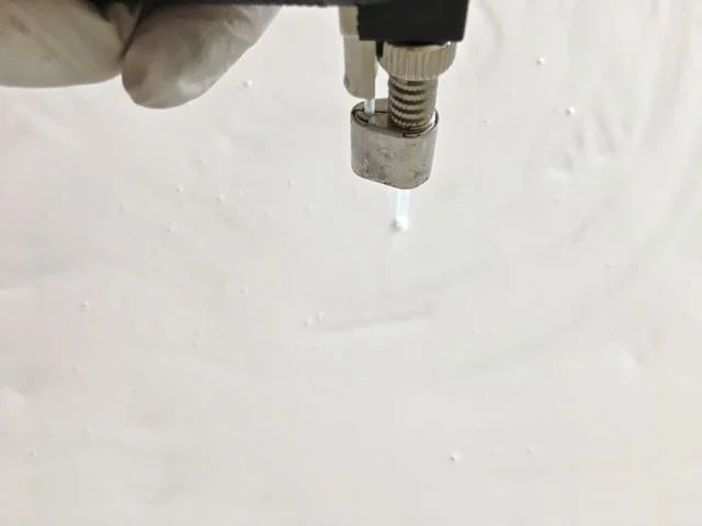 step 4 - Wave a kitchen torch across the paint surface to pop bubbles. Also do this after pouring each paint color.