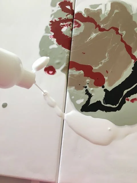 step 10 - Generously outline the colors with white paint from the squeeze bottle.