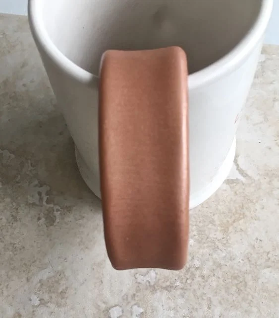 step 5 - A coffee mug is a convenient place to hang the bracelet and work the following steps.