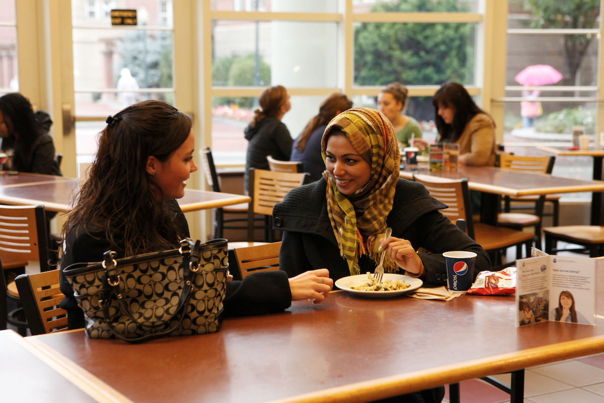 JWU students talking and eating in Snowden
