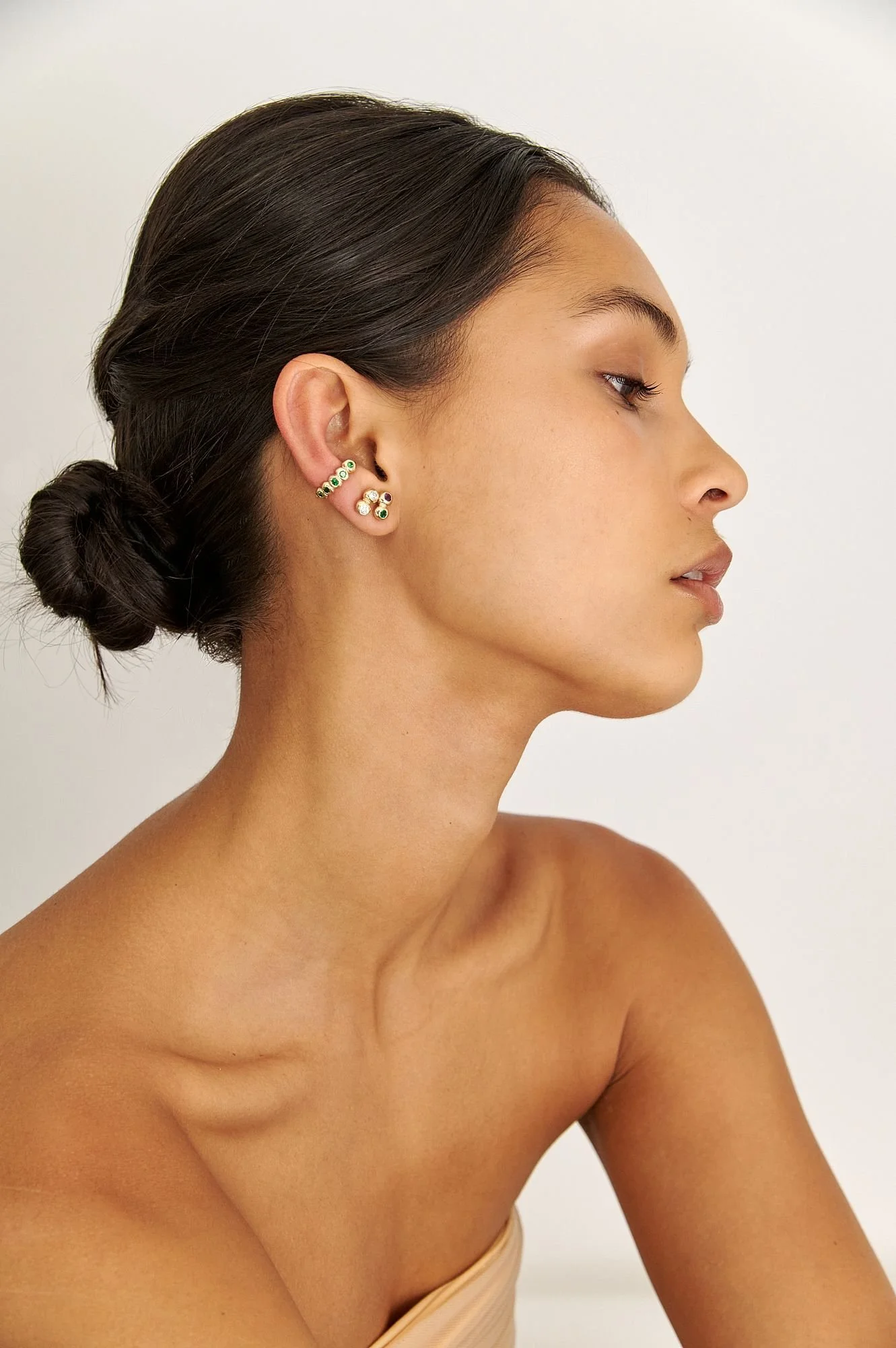 Tsavorite Ear Huggie and bubbles.jpeg