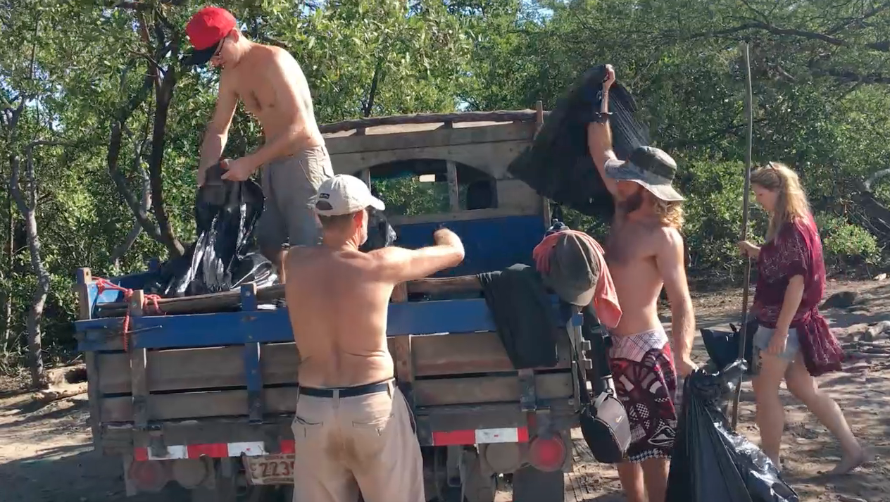 Charlie, Garry, Silas & Heather loading up the many bags of rubbish into Buckie the Bongo.