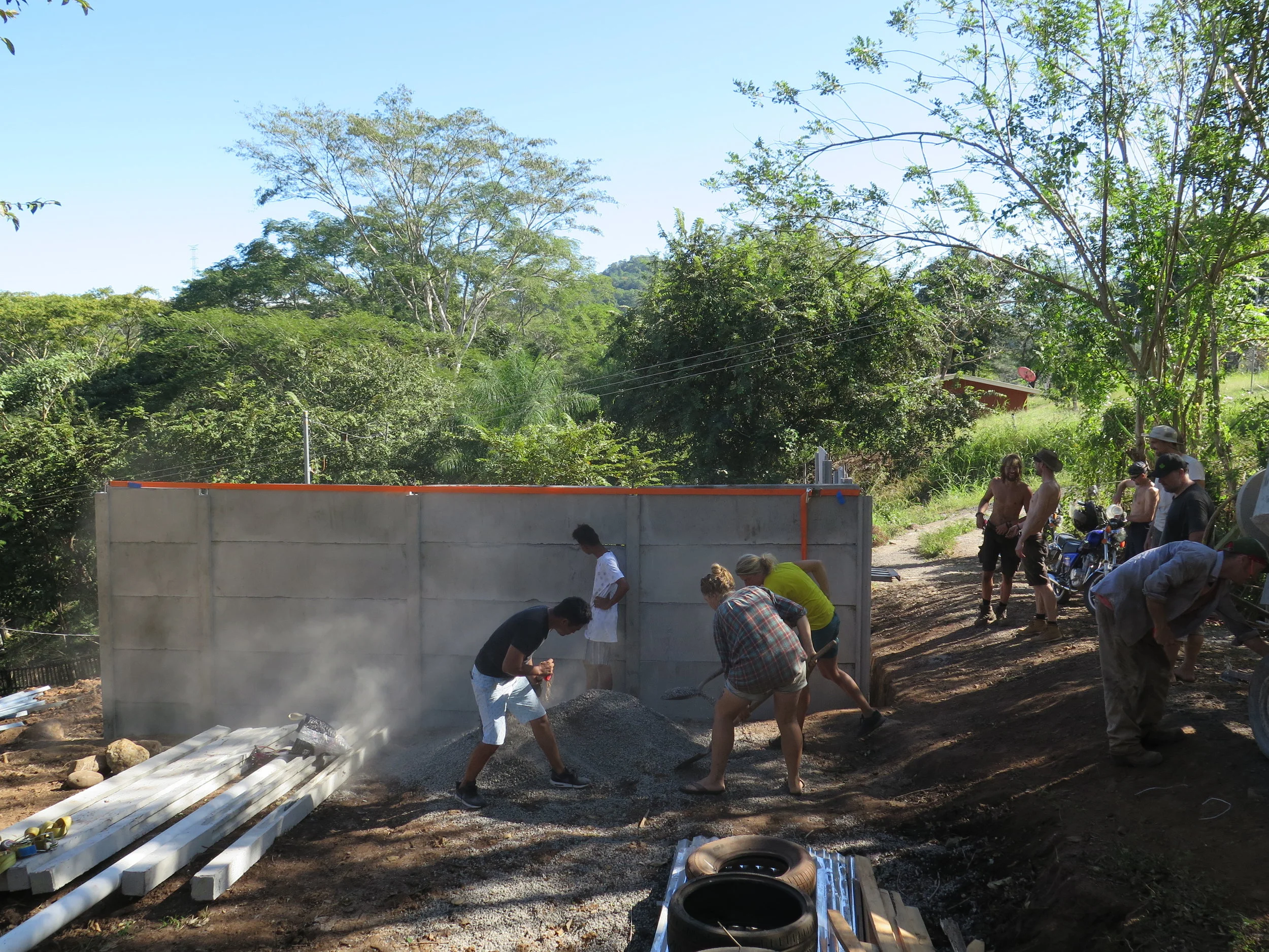 Concrete mixing in preparation to set the posts in the ground.