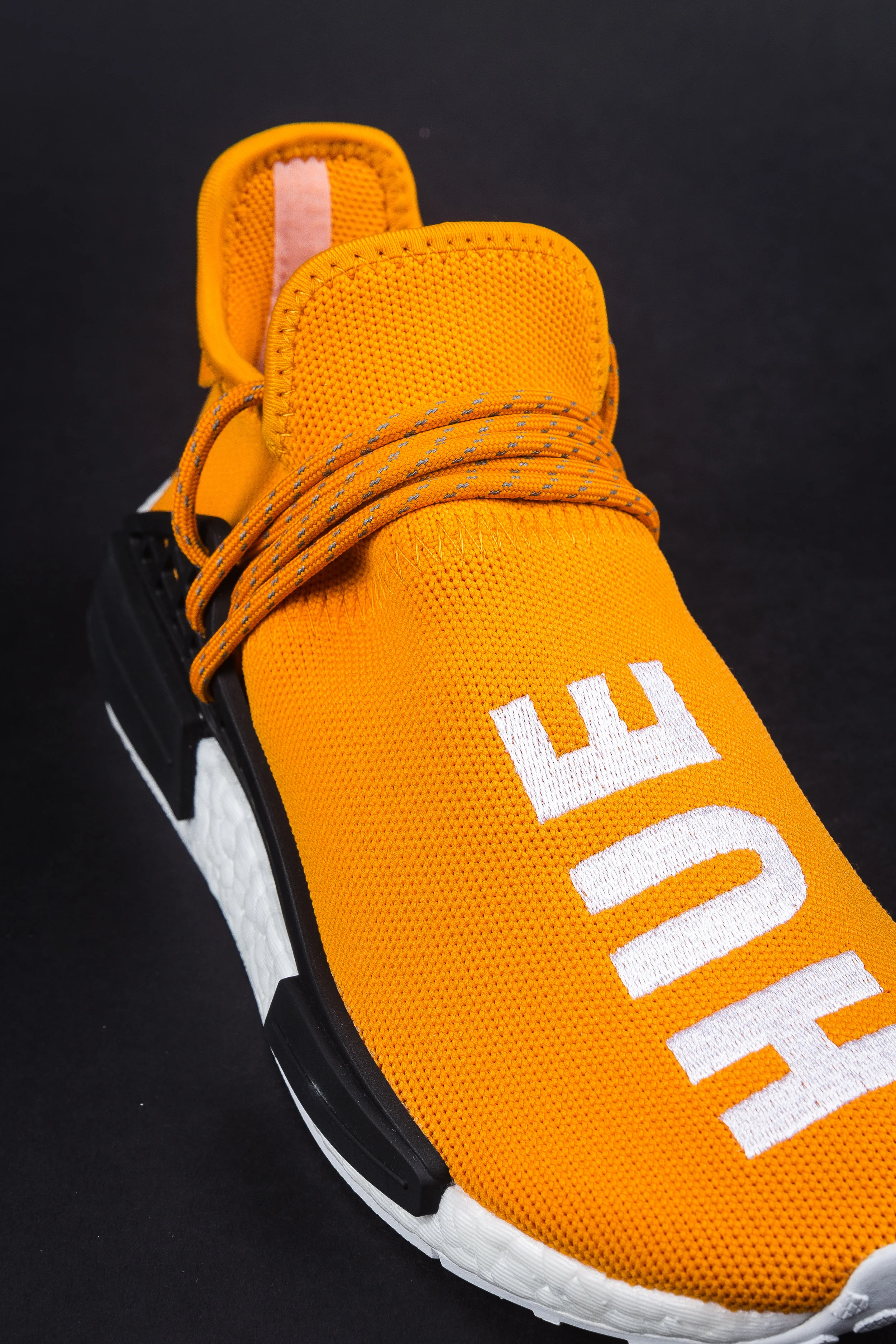 nmd human race tangerine