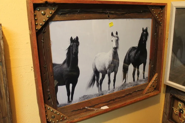 three horses in leather tooled barbed wire frame.JPG