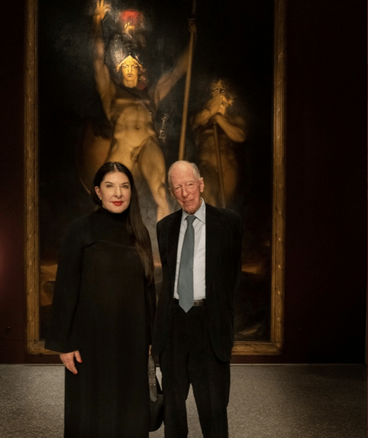 On Good Friday Bill Gates’s Microsoft firm ran an ad featuring prominent satanist Marina Abramovic, who makes “art” out of blood, gore and cannibalism. She poses here with Jacob Rothschild, in front of Sir Thomas Lawrence’s 1797 painting “Satan Summoning His Legions.” In a promotional video posted on Microsoft’s official YouTube account, Abramovic is described as the “most legendary performance artist working now.” After 24,000 down votes, Microsoft pulled the ad. See here and here .