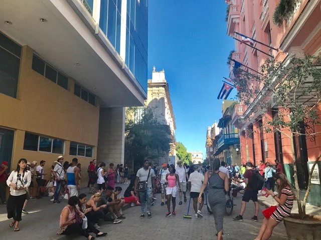 You will walk by spots like these where there will be a cluster of people looking down on their phones. This is an indicator that it is a "wifi" zone.