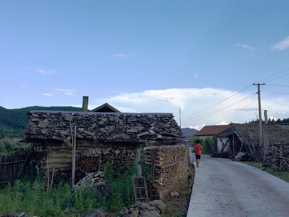 KyungTae walking near his home in Northeast China.