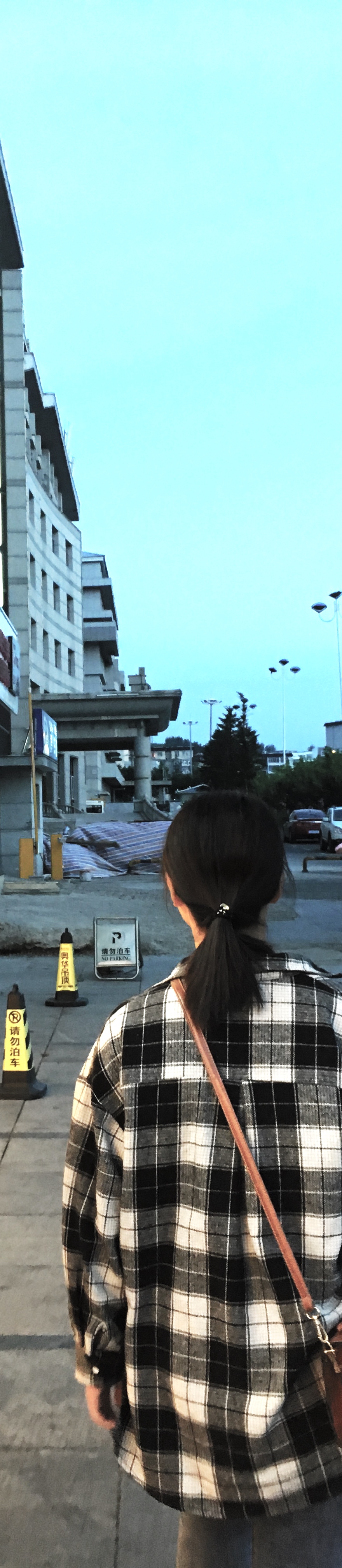 SunYoung, a North Korean orphan living alone in China, walks along bustling city streets.
