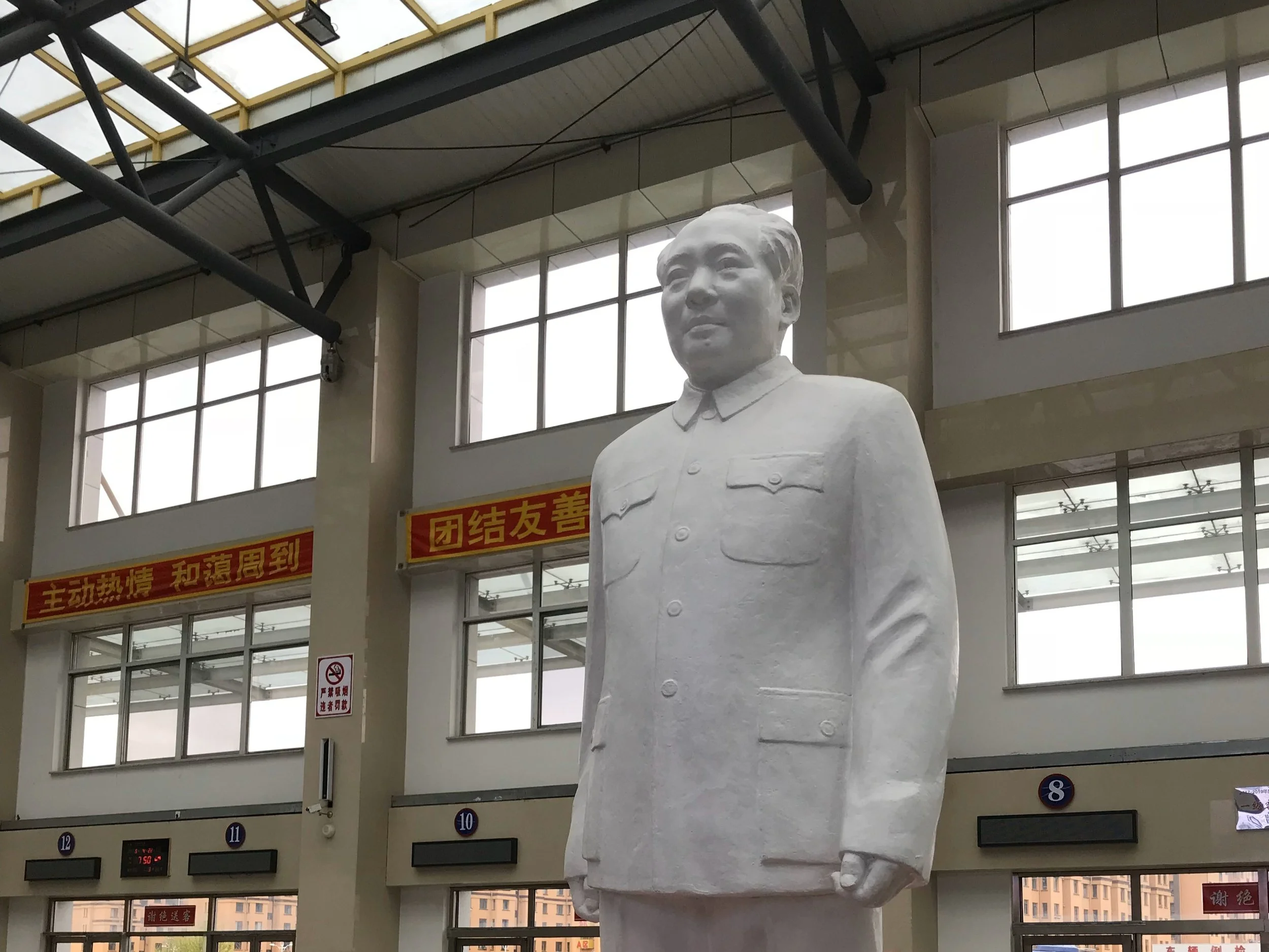 A statue of Mao Zedong in China bus station