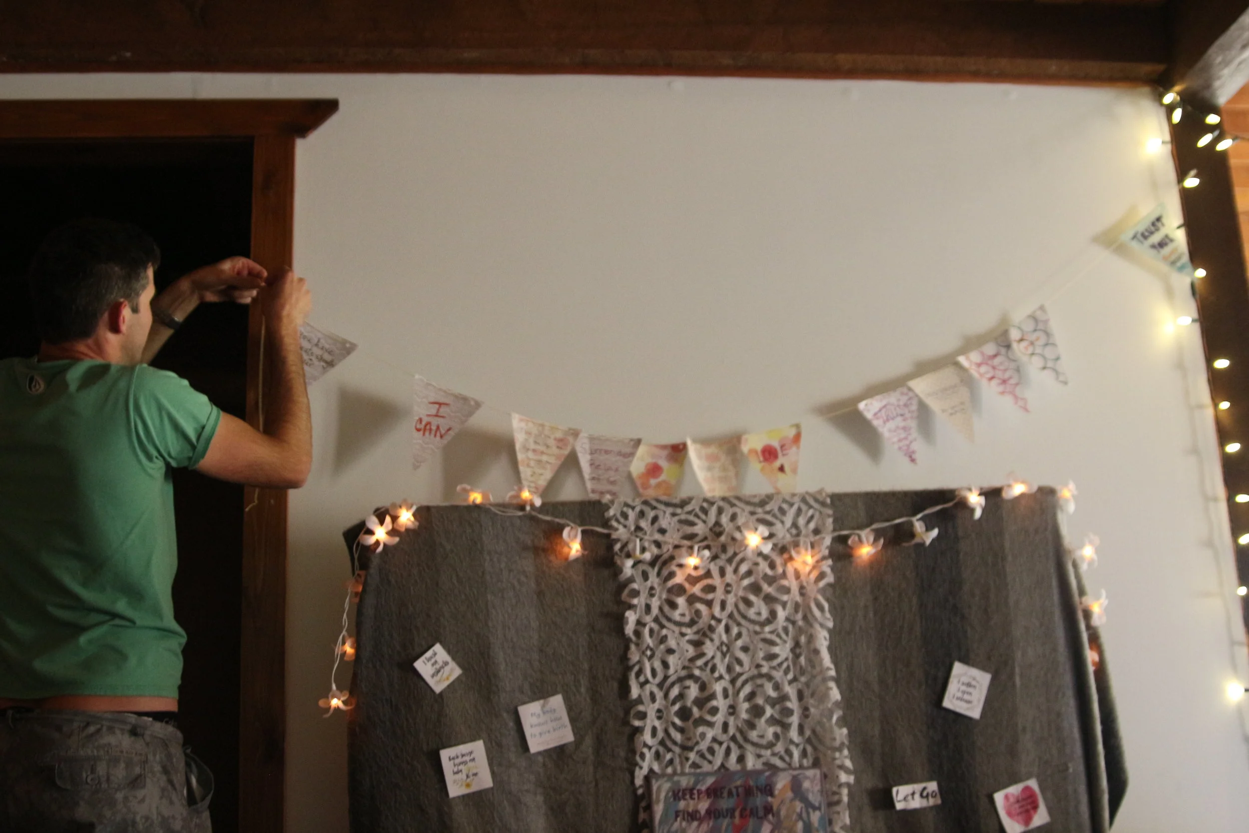 My husband re-arranging my affirmations during my labour for a better view!
