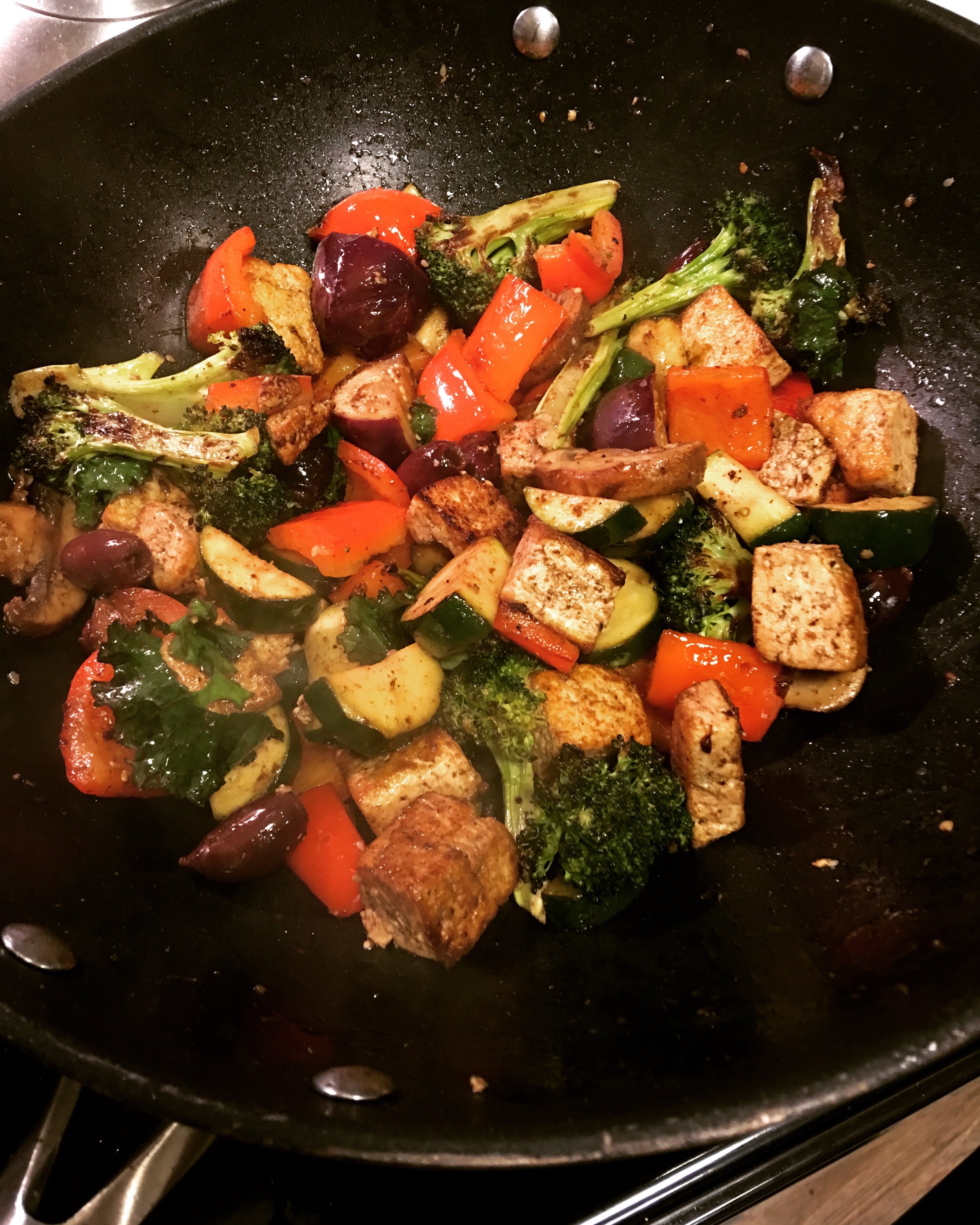 Greek Skillet With Tofu, Kale and Fig-Balsamic Vinaigrette This was a "use up everything in the fridge" recipe; first I pan-fried the tofu, then tossed in zucchini, bell pepper, kalamata olives, some leftover roasted broccoli, baby Thai eggplants, mushrooms and kale. I also tossed in some pre-made fig-balsamic vinaigrette and finished it with crumbled feta.