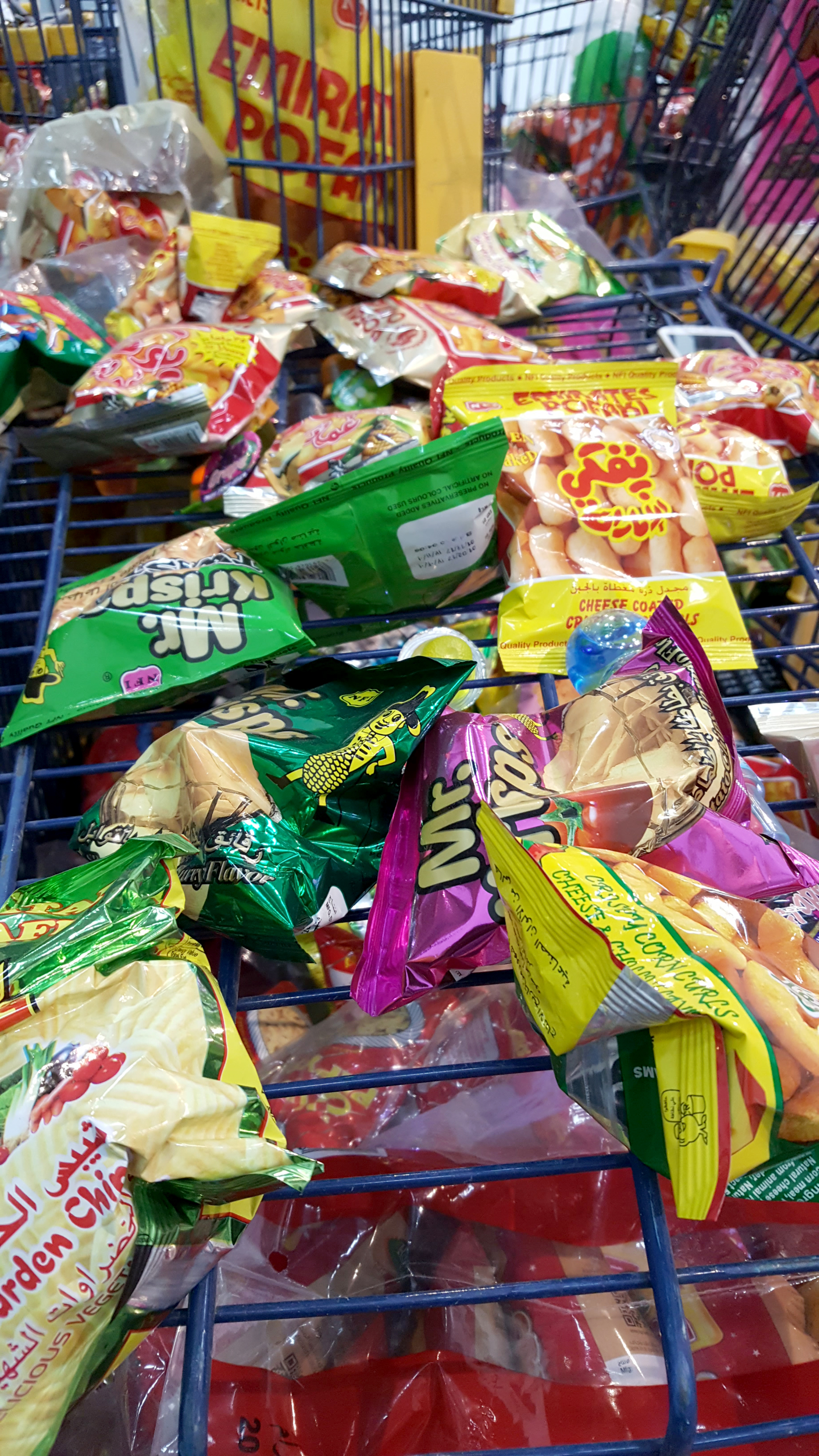 Many chip packets and unopened jelly shots filled many blue trolleys.