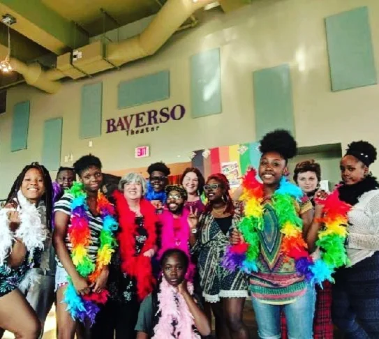 Our fabulous setup crew of staff and volunteers modeling our boa rainbow