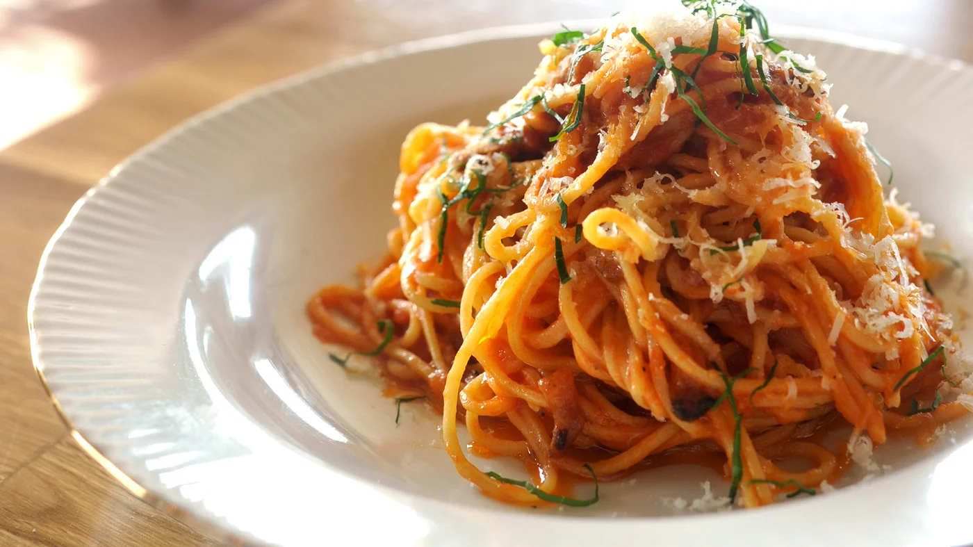 Pasta All'Amatriciana: bucatini or spaghetti, guanciale, tomatoes, pecorino, and dried hot chili pepper