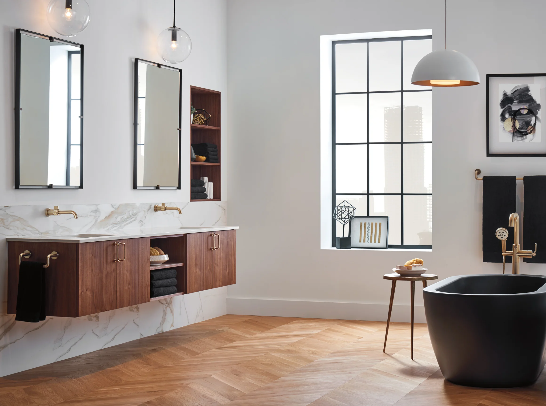 Brizo Litze collection minimal bathroom showroom interior with black tub and brass fixtures