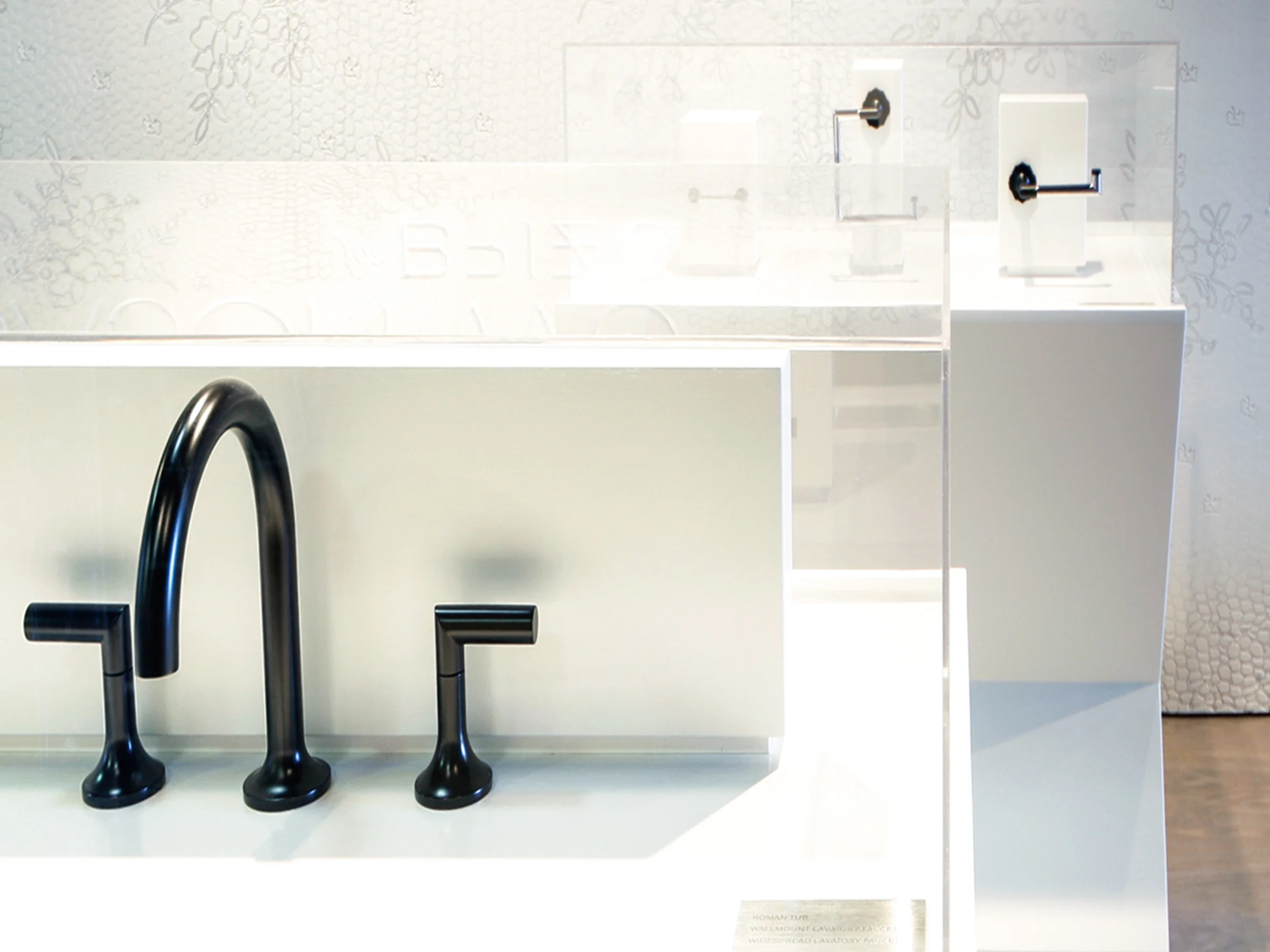 Brizo Jason Wu collection minimal modern bathroom showroom with black fixtures
