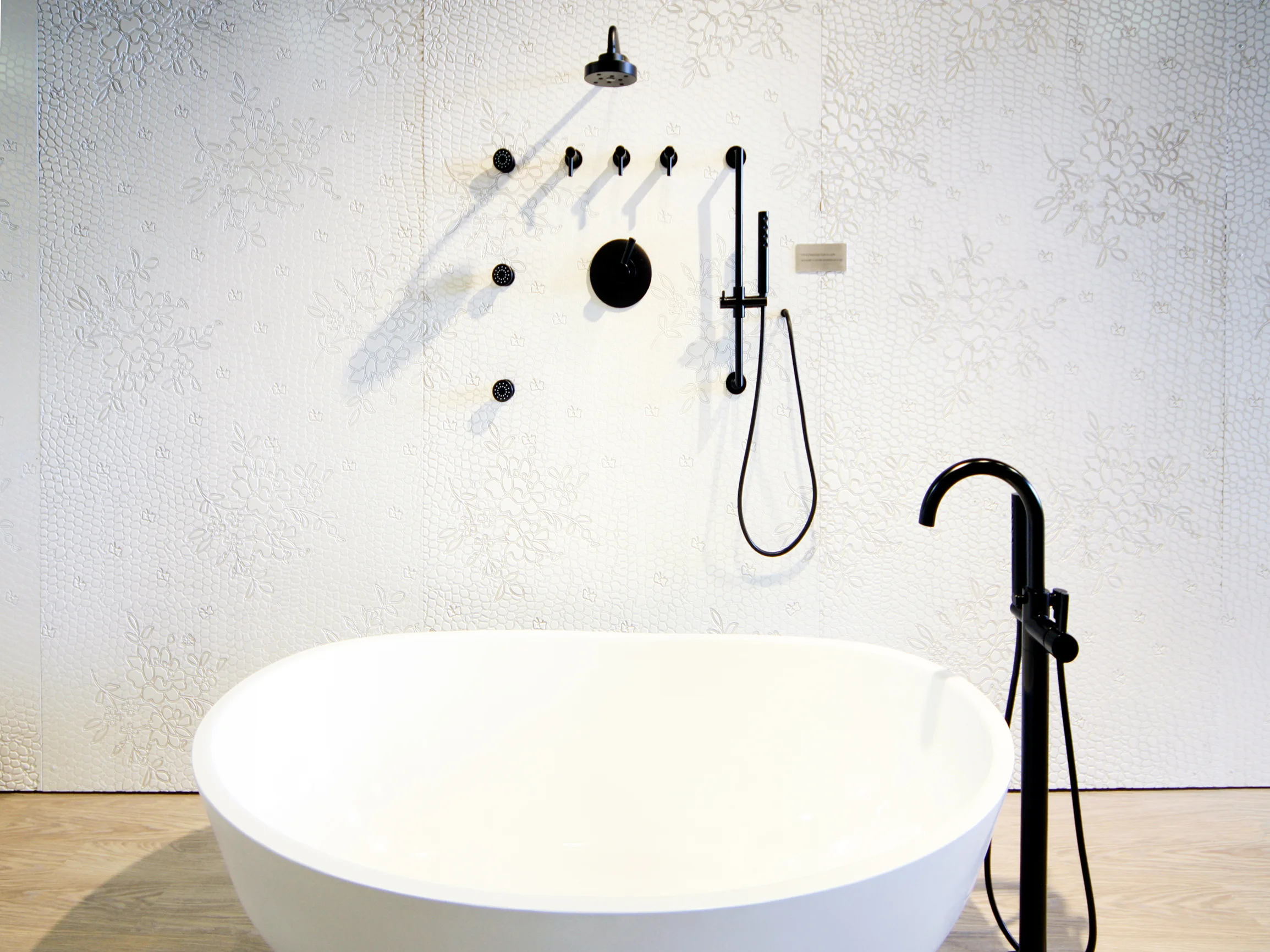 Brizo Jason Wu collection minimal modern bathroom showroom with black fixtures