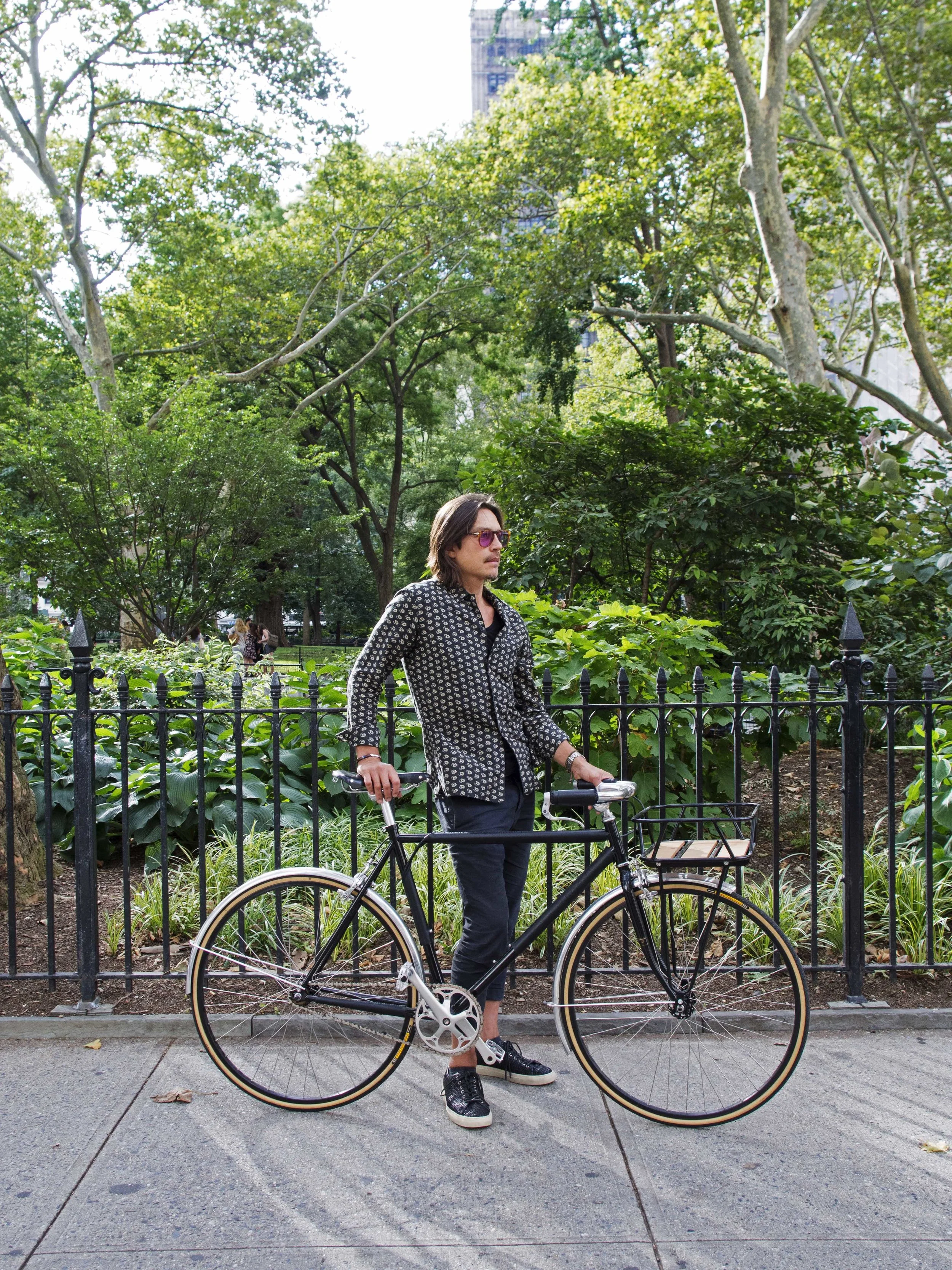 Men's black bike Madison Square Park spring New York city