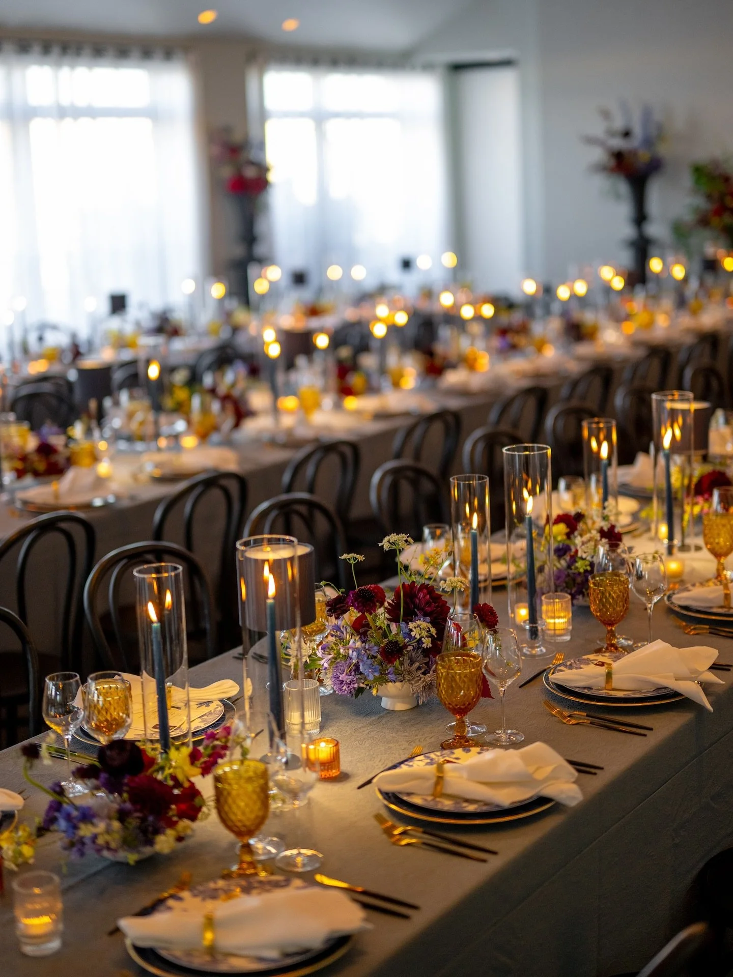 A feast for the senses. Katie &amp; Hampton&rsquo;s brasserie-inspired celebration paired bold, sculptural florals with layered textures and unapologetically rich tones. Designed to feel like an underground supper club meets a true extension of the b