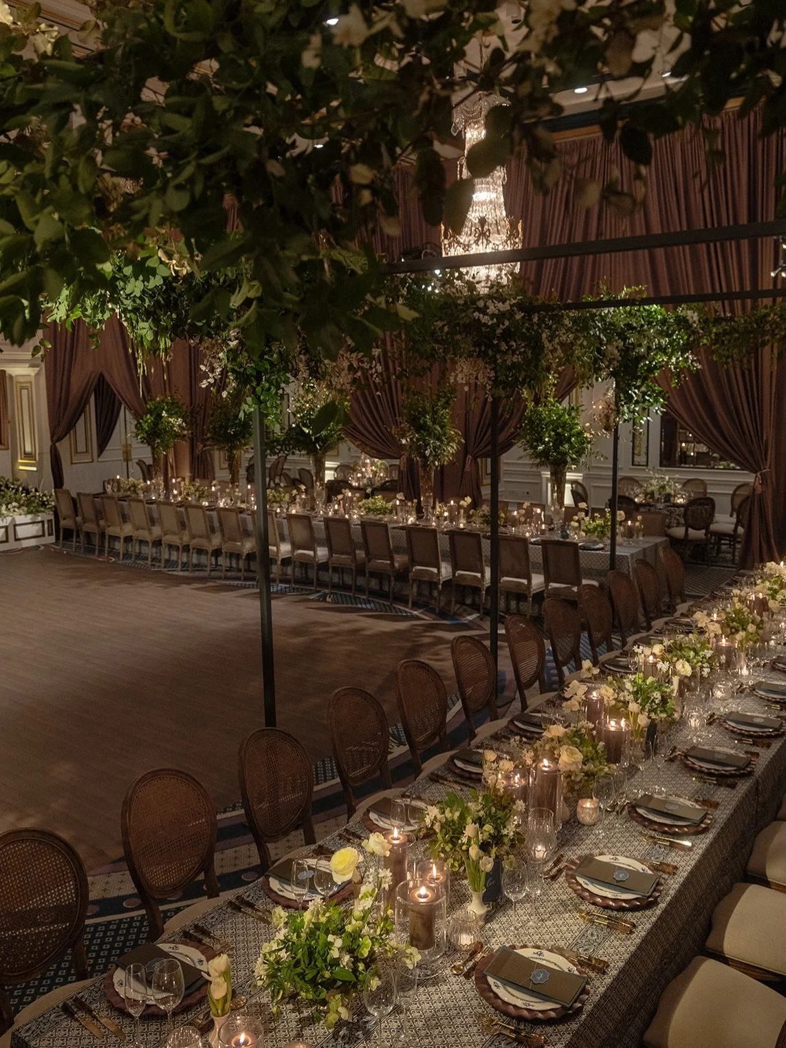 Love day, reimagined.

For Madeline &amp; Nate&rsquo;s wedding, we moved away from the expected, embracing a palette of decadent chocolate browns, deep navy, and abundant greenery to make the occasion entirely their own.

Dramatic draping, bespoke st