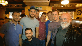 Matt Molloy with members of the Mayo Senior Football team in Matt Molloy's pub, Westport