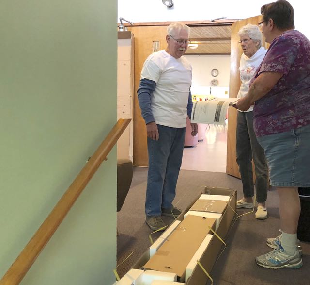 John McCormac, Carol Cozart and Ginny McColm putting a trolley together.jpg