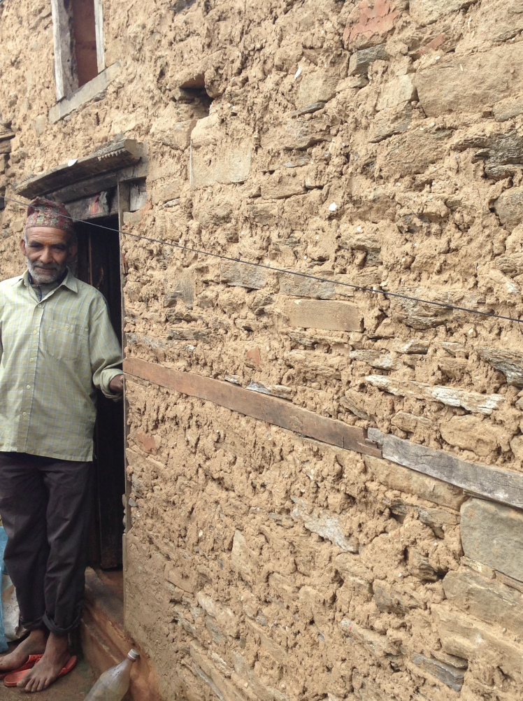 Nodanath Mishra, one of the kindest men I know, stands next to his newly built home. Similar to those built before the earthquake, this home is made of stone and mud.