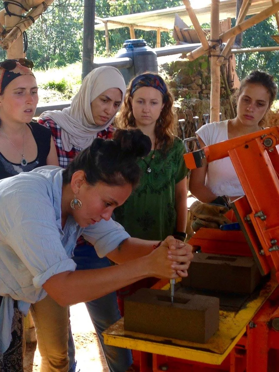Mariana Jimenez shows volunteers how we test each batch of CSEBs during their training at the Takure Training and Production Center. 