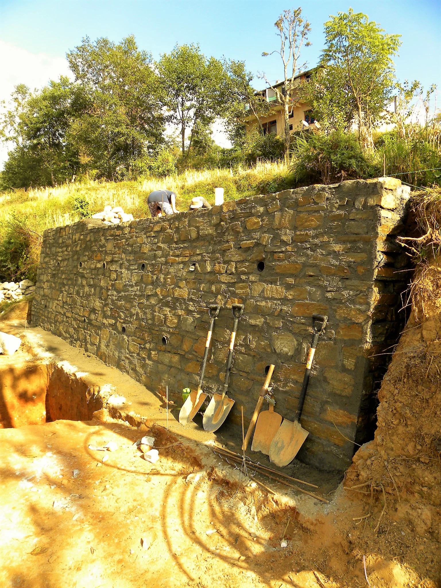 AFTER- The retaining wall is completed! 