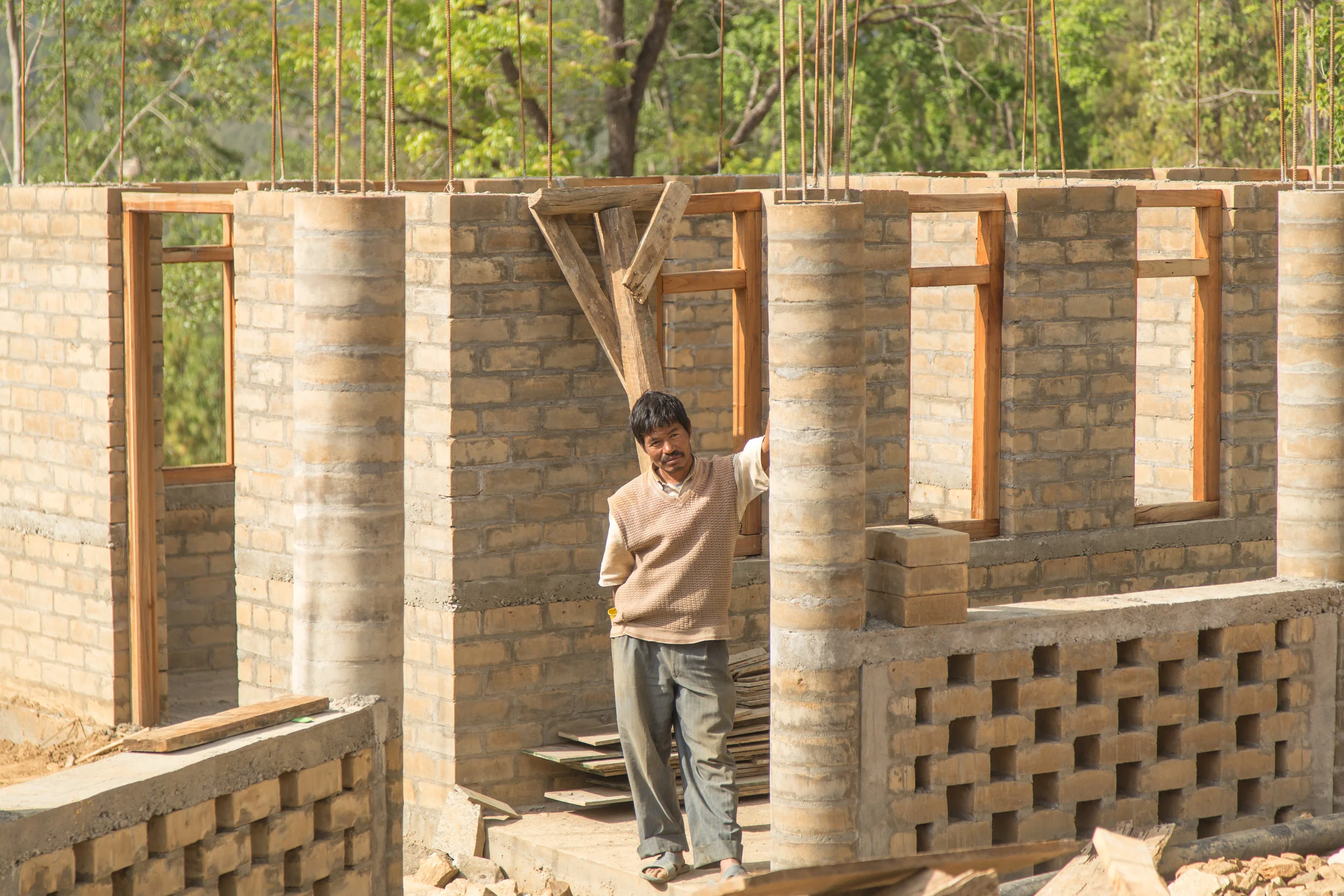 A proud mason showing off his handiwork.