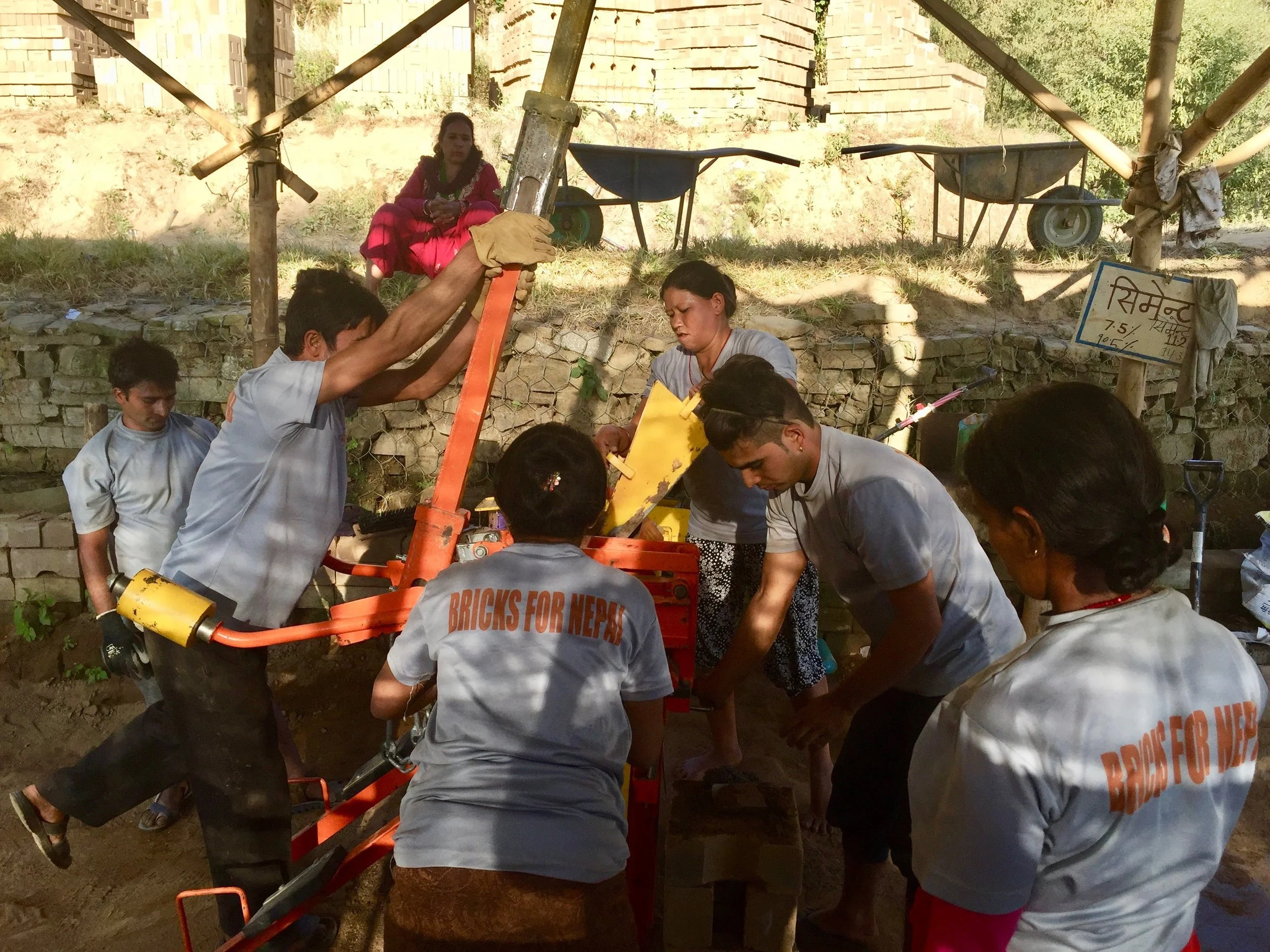 Photo 3: The Conscious Impact “Bricks for Nepal” construction team produces environmentally sustainable and earthquake-safe CSEBs as quickly as possible to be distributed across Sindhupalchok