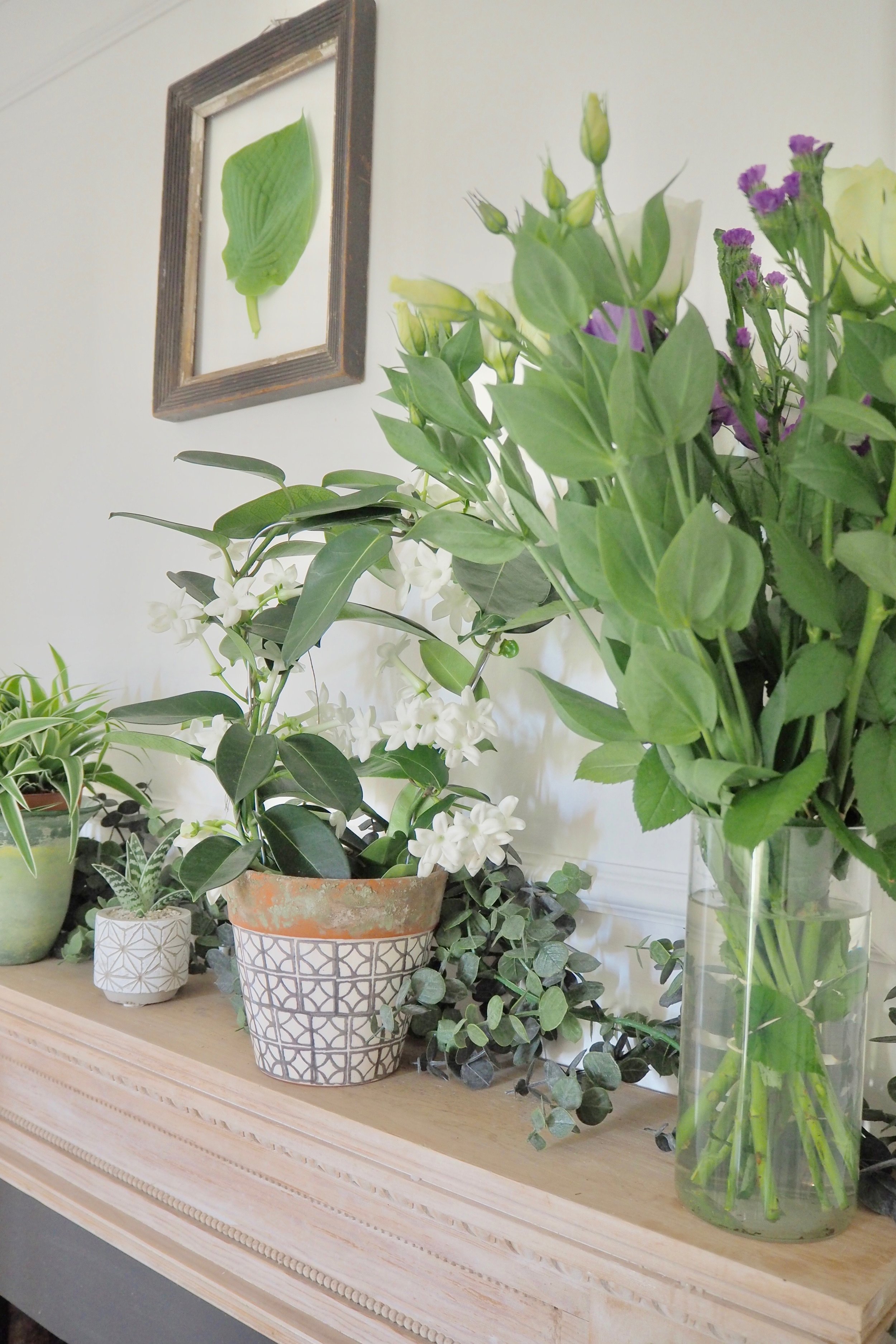 How to style your mantelpiece to create an interesting and different feature. Try using greenery like this example from Camilla Pearl Blog.
