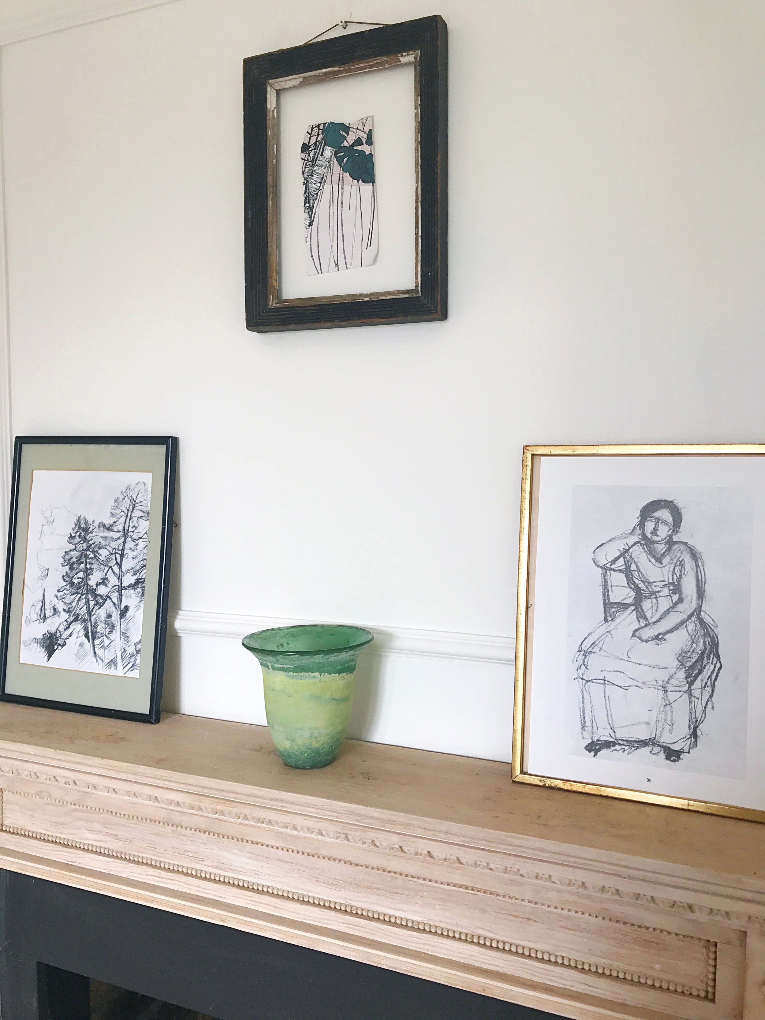 A simple gallery wall for styling your mantelpiece.