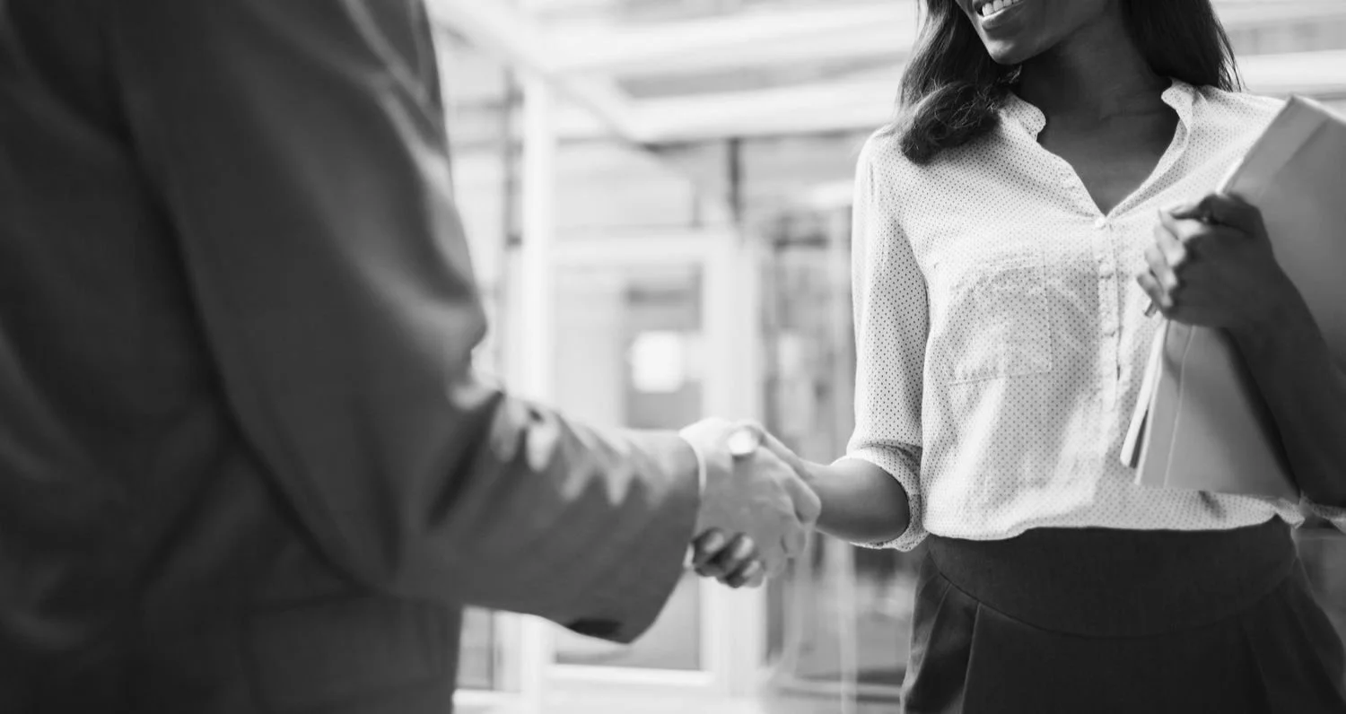 business-people-shaking-hands-outside-of-office-building-521813417-5954fdc33df78cdc2970d5ac.jpg