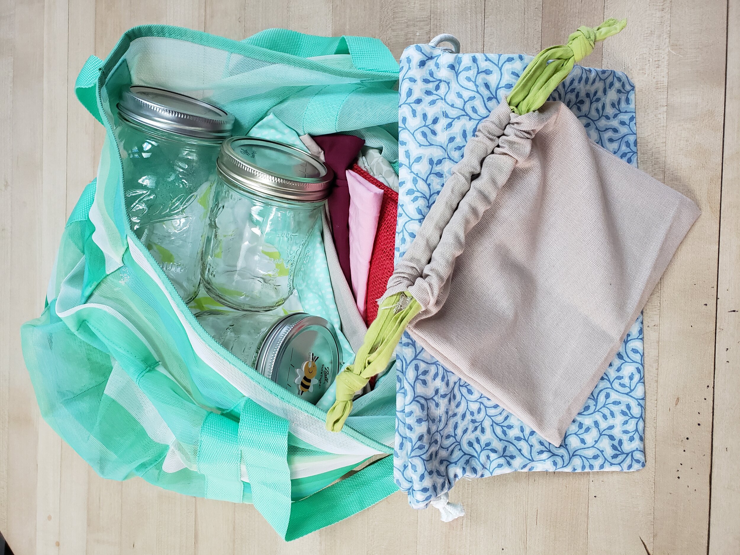  My shopping kit includes cloth bags for bulk solids, mesh bags for produce, and glass jars for liquids.  