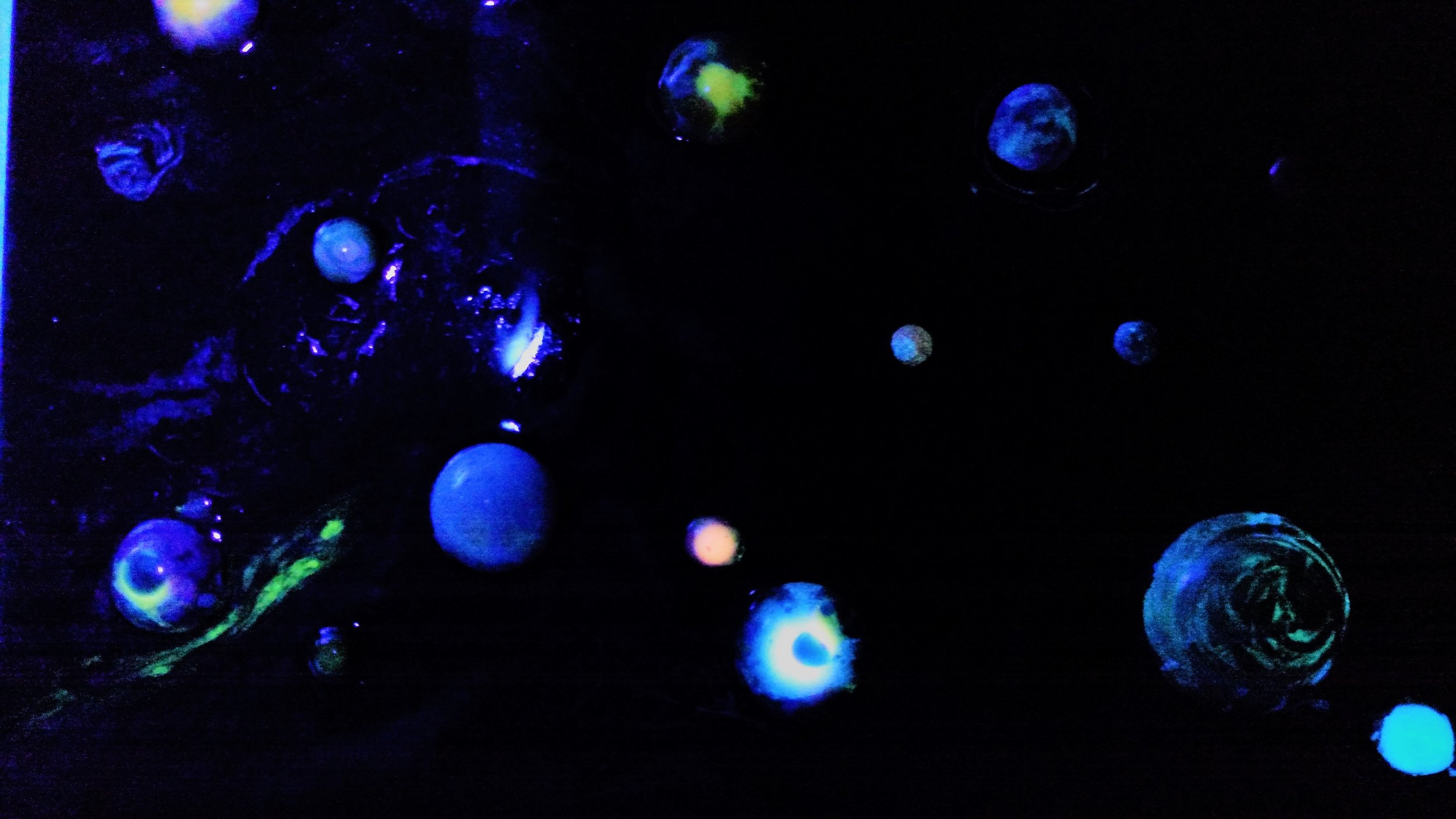 Stars and planets glow, use the included blacklight flashlight to "charge" your planets.