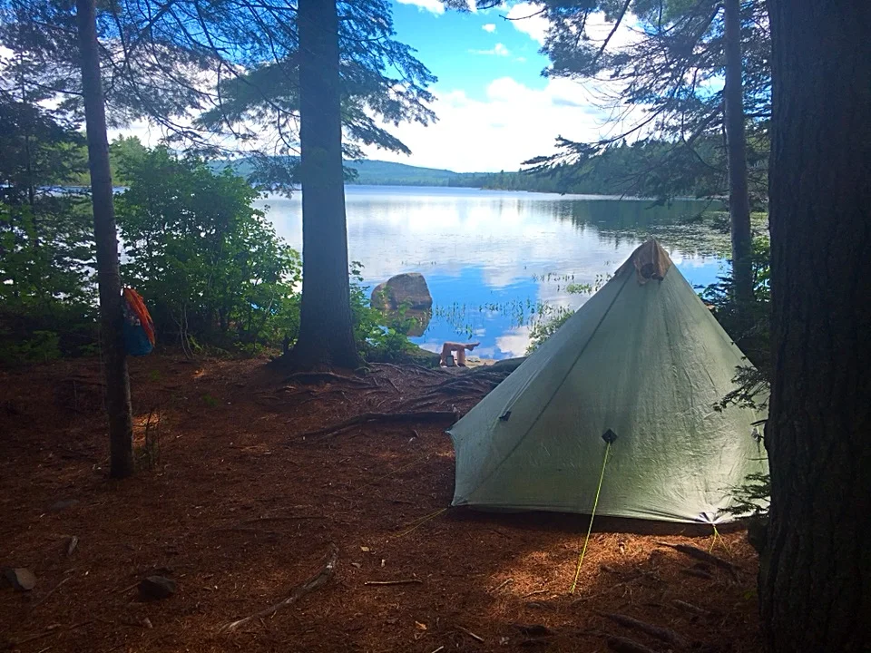 But the rewards, in the form of exquisite waterfront campsites, are worth the extra effort. (Do you see U Turn’s legs down by the water?)