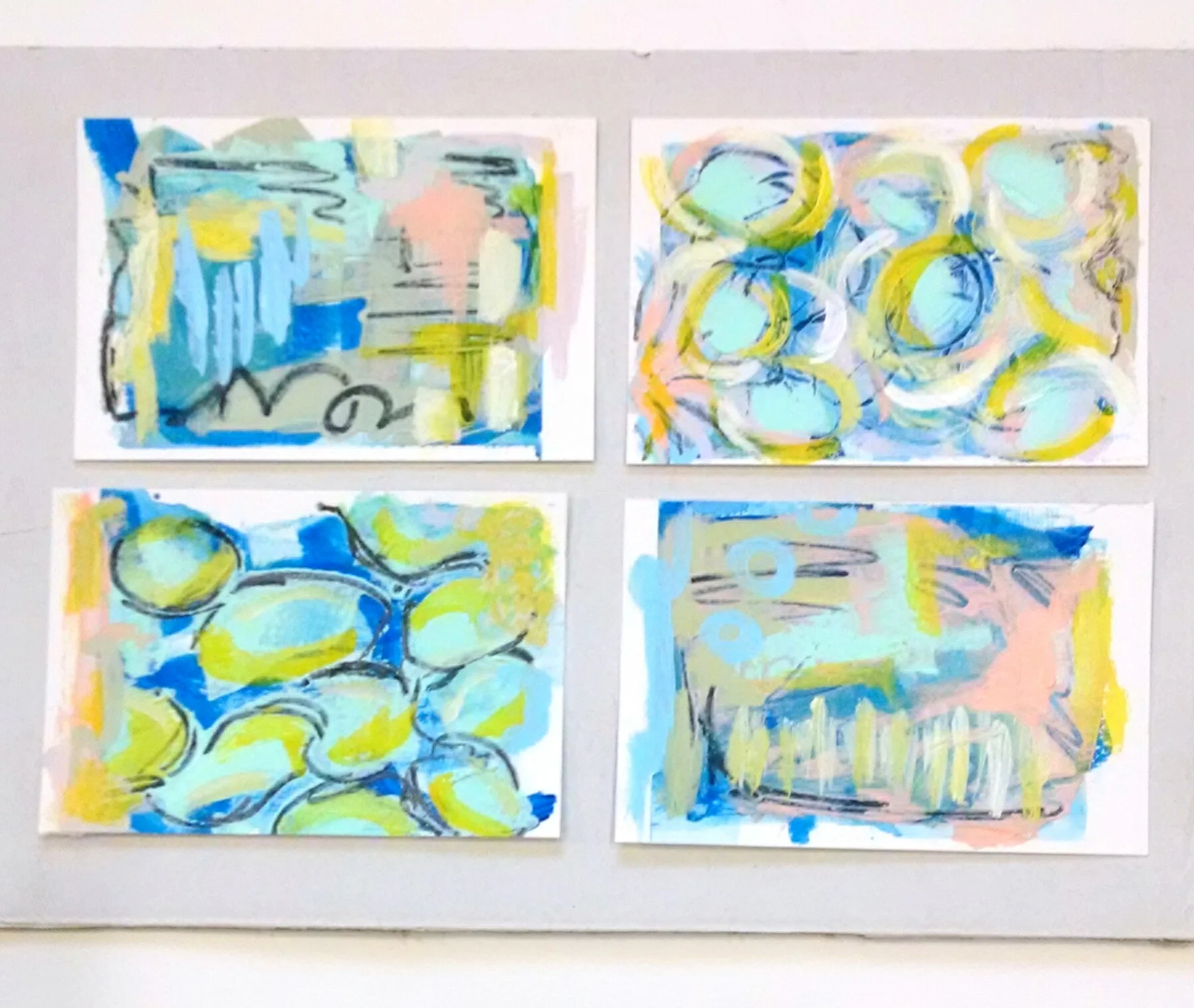 I gave the new light value Heavy Body GOLDEN colors a test drive on top of a Primary Cyan background in these 4x6" mini paint sketches.