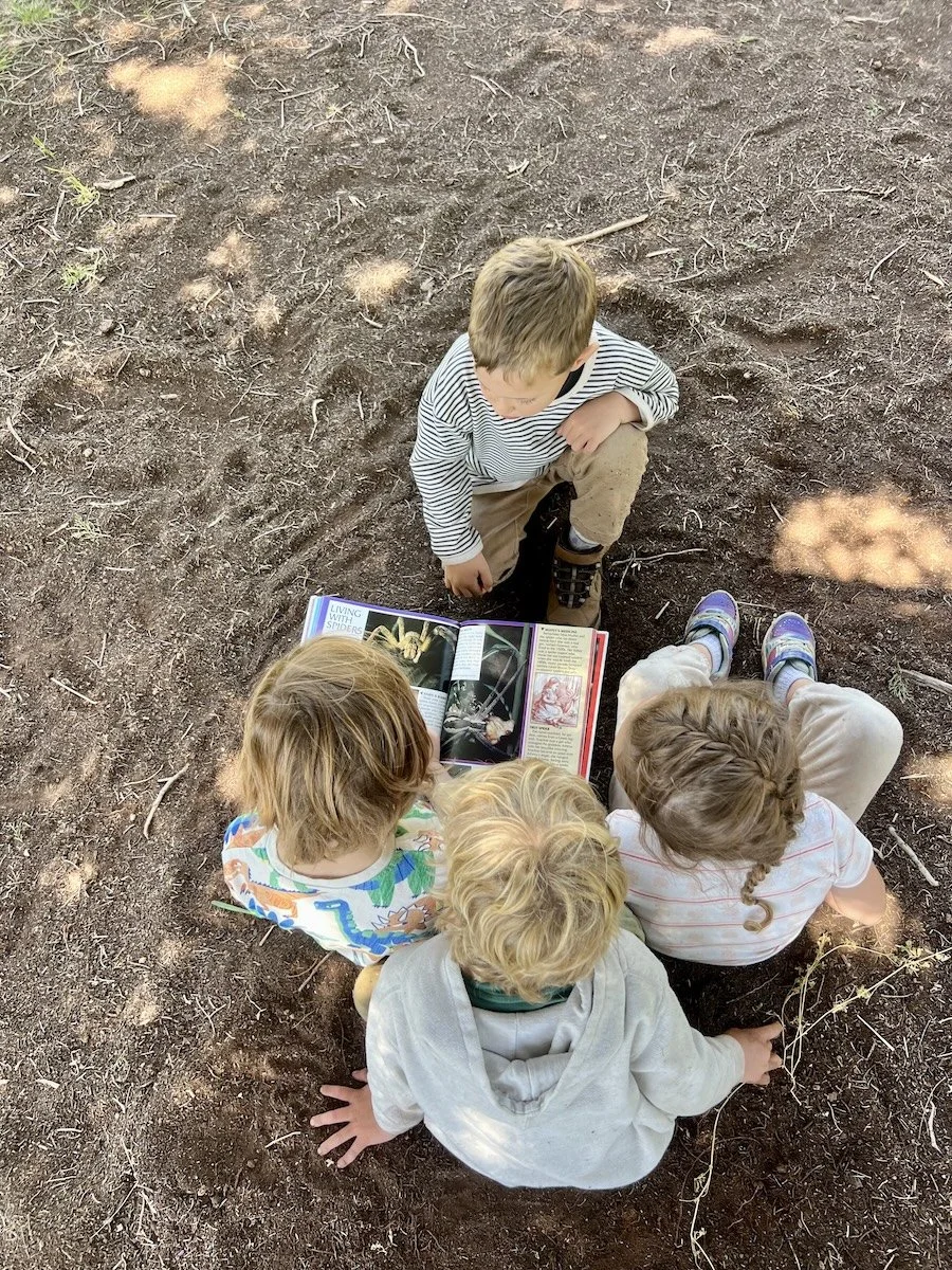 Fox Kit kids looking at field guide.jpeg