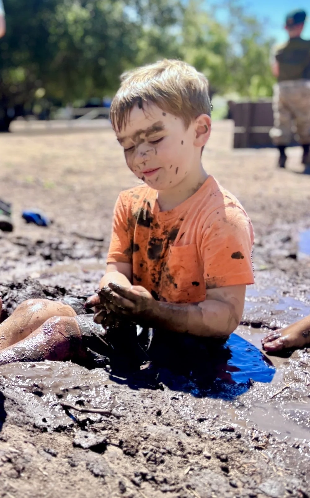 Coyote Pup child playing in the mud during the fall.jpeg