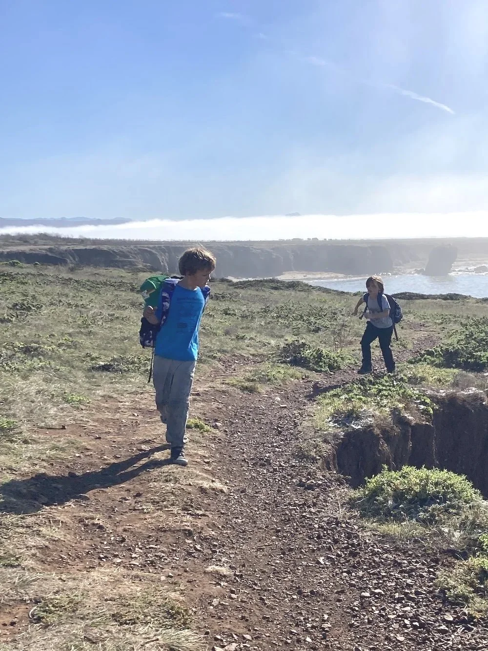 Two boys at summe camp walking along the cliffs of San Luis Obispo Coastline.jpg