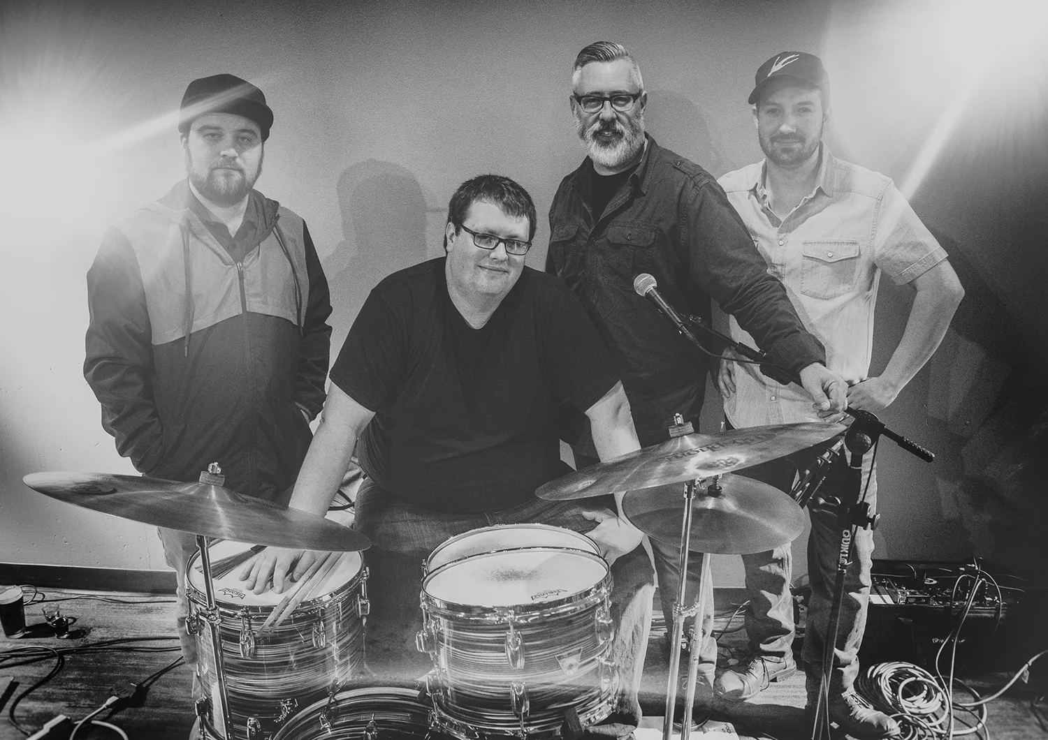 From left to right: Kelvin Kaspar - Guitar, Mike Malone - Drums, Matt Vanderlinden - Bass, Greg McMonagle - Vocals