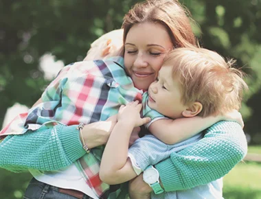 mom hugging 2 boys - Parent coaching with in tune connections