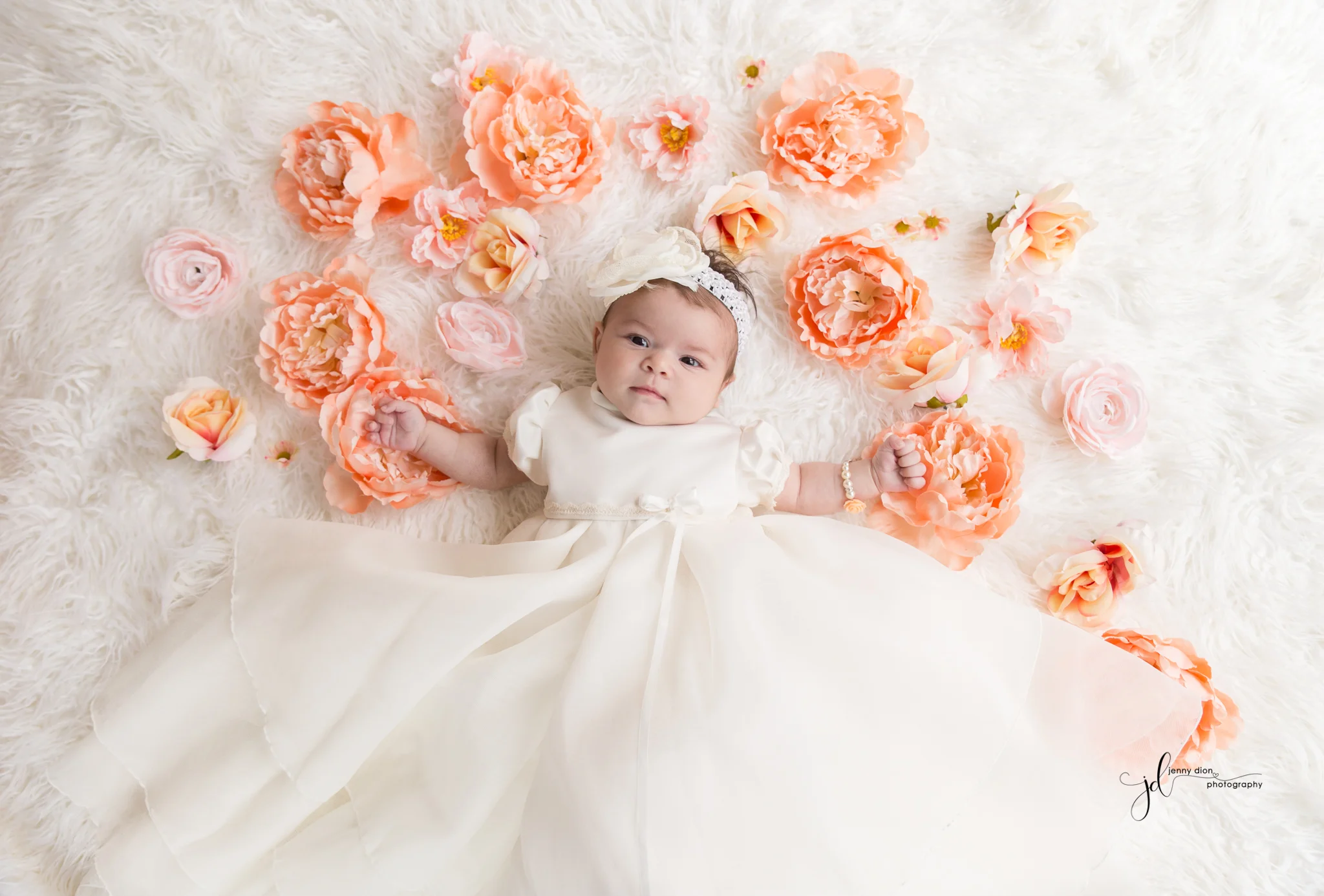 In her beautiful christening gown.