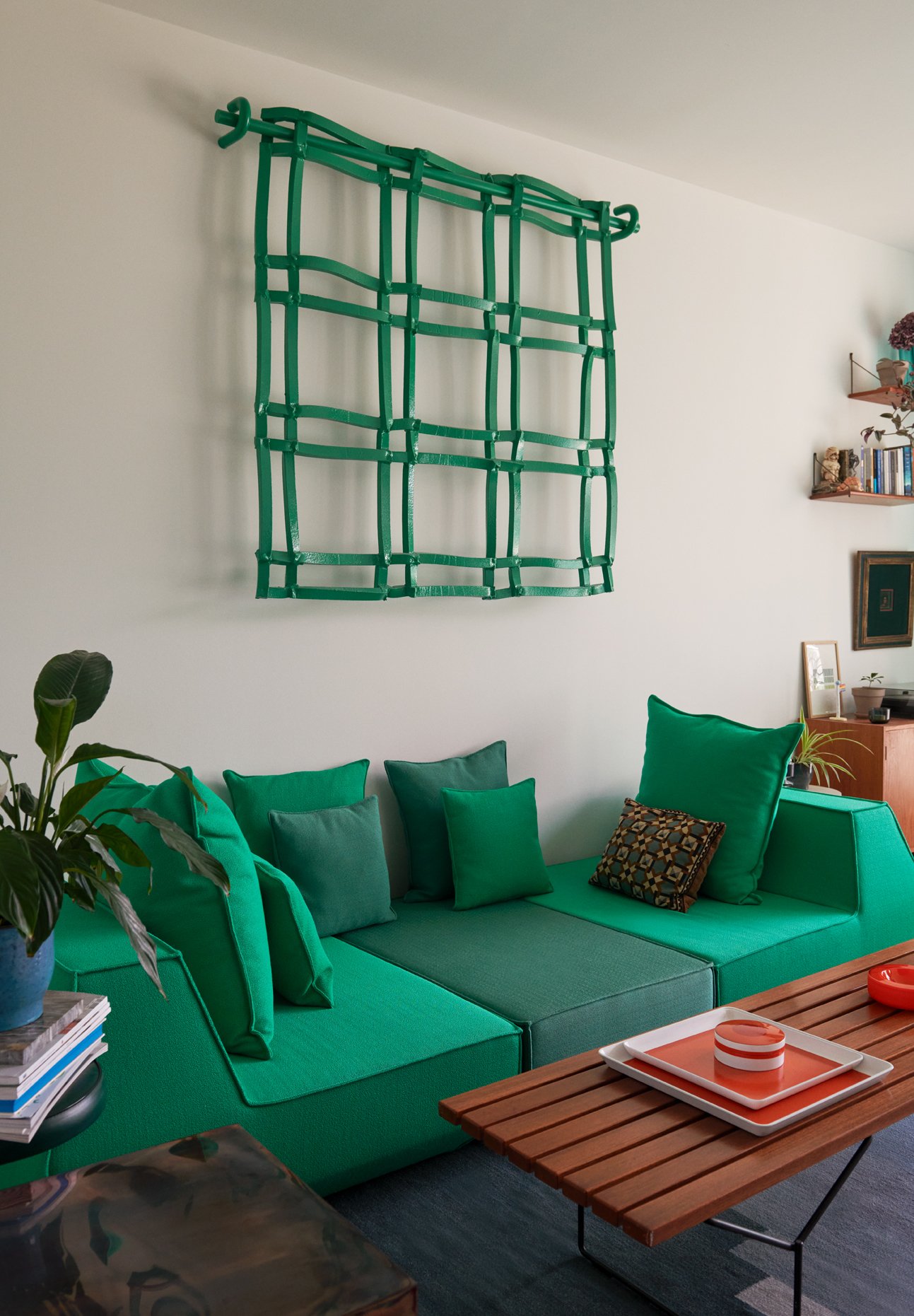  The centrepieces of the living room are Denys’s forest-green ‘Foam Fence’, and a sofa he originally created as outdoor seating but in this instance upholstered in ‘Vidar 4’ fabric, by Fanny Aronsen for Kvadrat. In the foreground is the designer’s ‘E