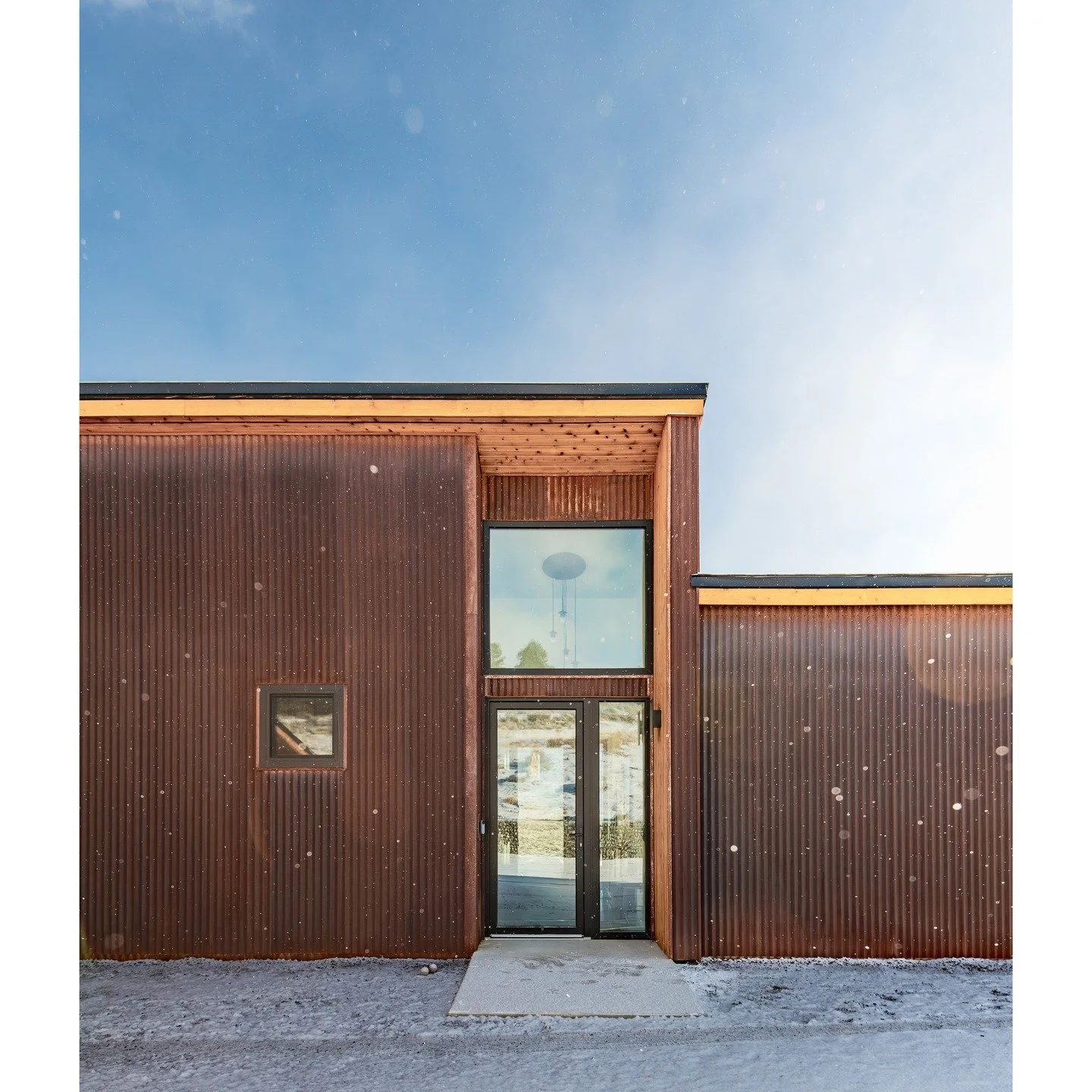 Our home in Twin Lakes is a super low-energy home designed to fit lightly onto the sloping hillside and open to expansive views across the upper Arkansas valley. Rusted corrugated metal siding and a long, horizontal form align with the topography whi