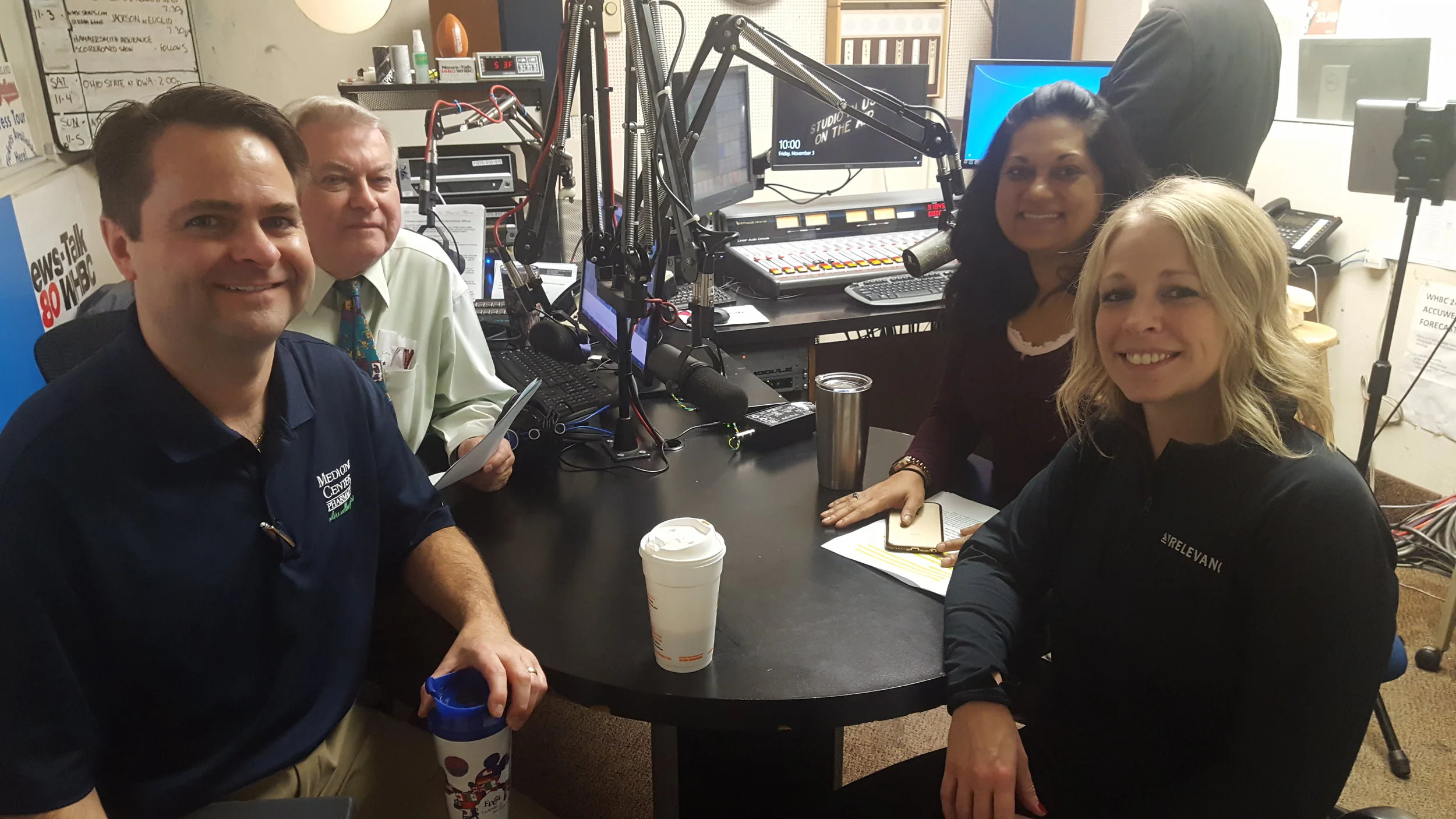 (L-R) Pharmacists Brad White and Paul White discuss stroke risks, treatment and Aultman Hospita l's Interventional Neurology Program with Dr. Tanzila Kulman, cardiologist and Jennifer Brackmann, associate vice president of neurosciences.