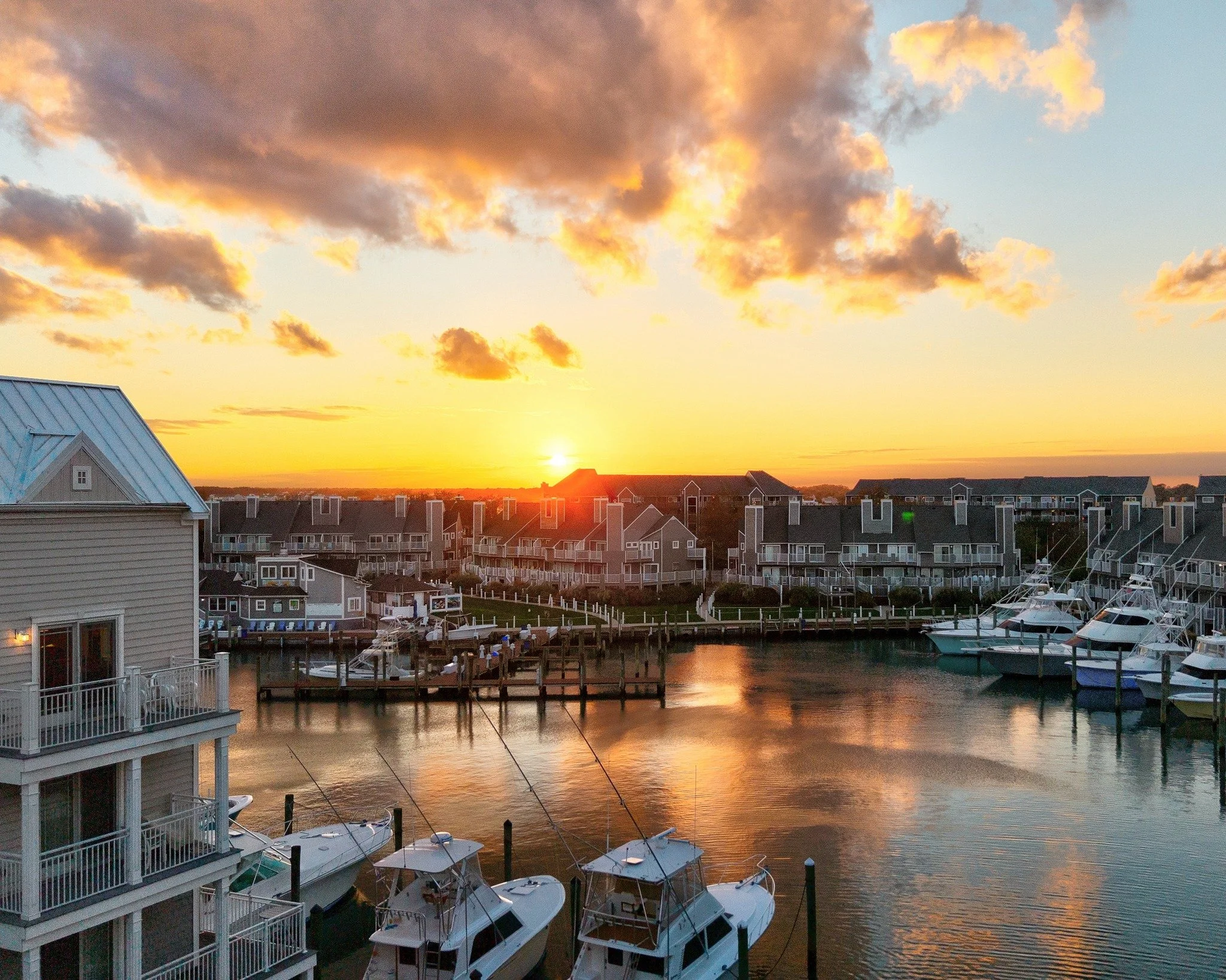 Golden hour at its best 🌅 This view says it all &mdash; calm water, a private marina, and endless sunsets just steps from home. Excited to share this incredible listing with @northroprealty !
