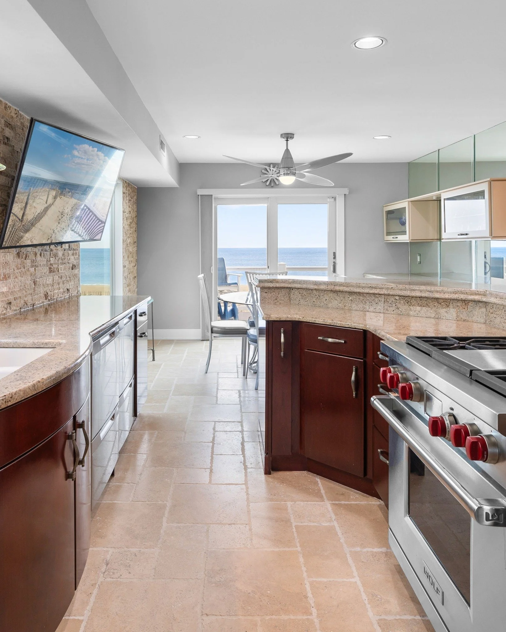 In a home like this, even the kitchen becomes part of the view.
High-end finishes and thoughtful design make the space feel elevated, while the balcony window draws your eye straight to the coastline beyond. Natural light pours in, connecting the hea